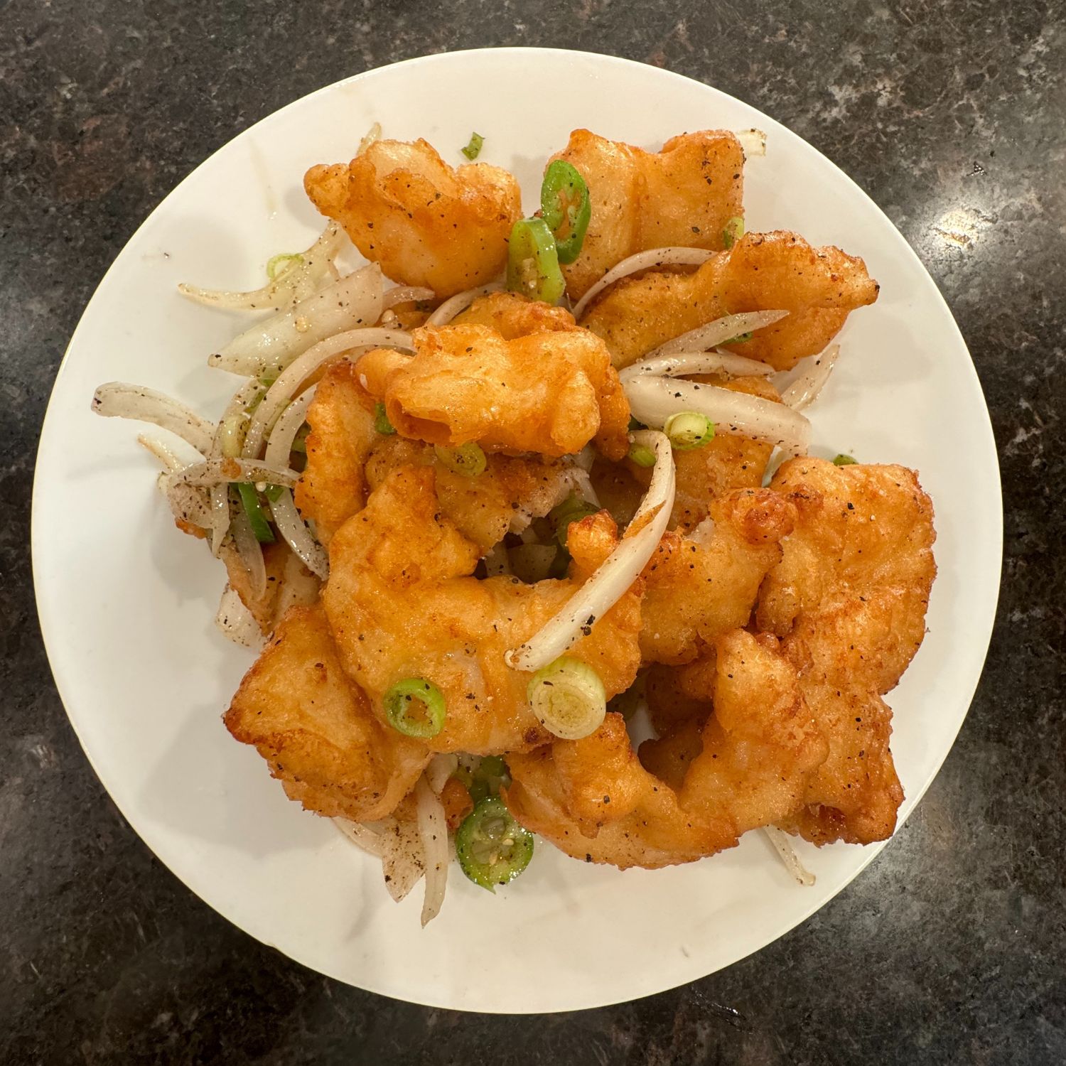 Crispy fried meat slices tossed with onions and green peppers at China Palace Restaurant, a Chinese Restaurant in Milpitas