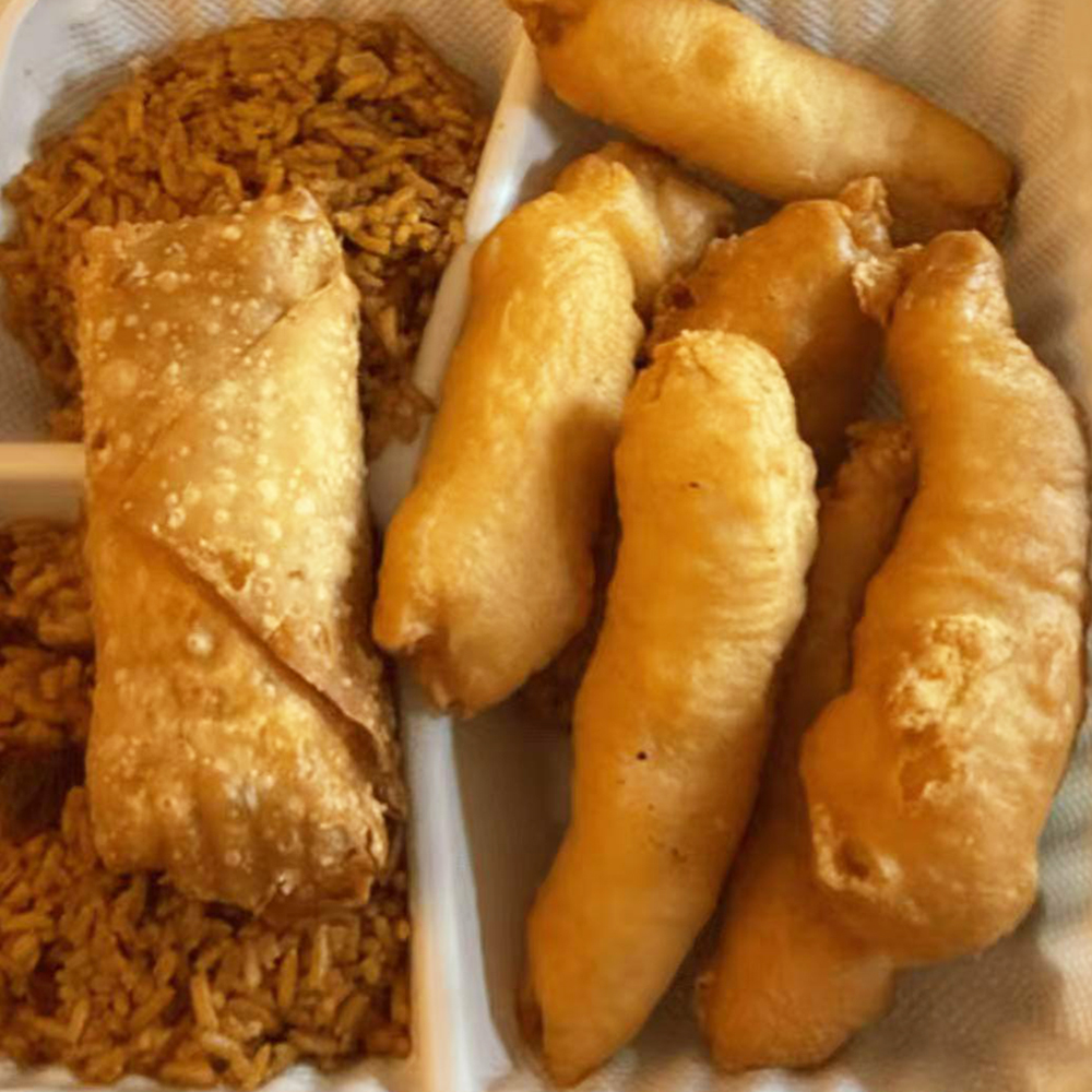 Sweet and sour chicken, and an egg roll at China Wok，a Chinese Restaurant in Bangor