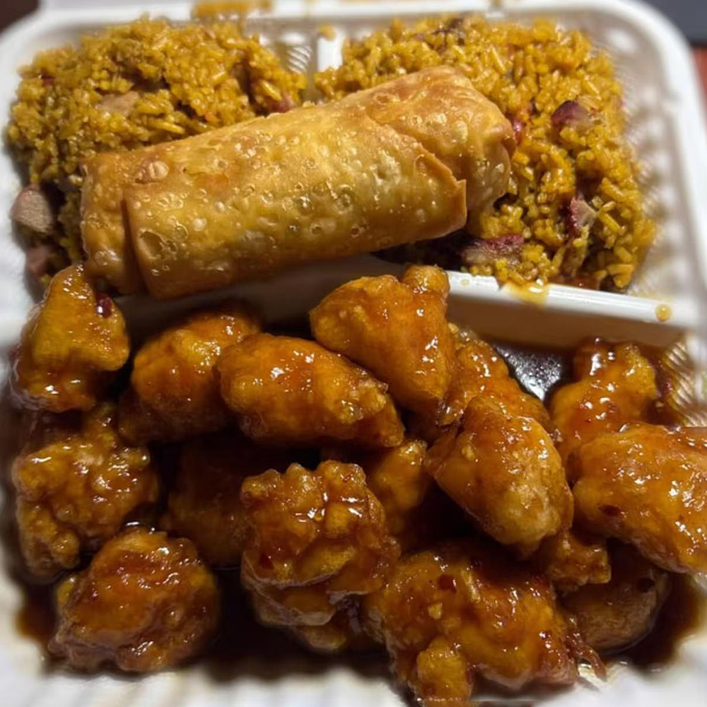 Gen Tso's chicken, a medium spicy dish, paired with a crispy egg roll at China Wok，a Chinese Restaurant in Bangor