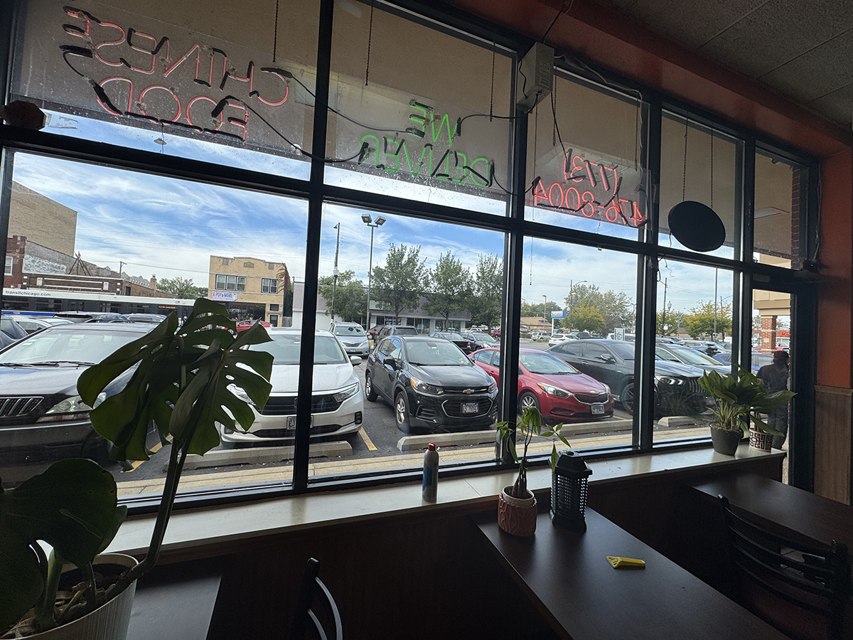Inside the restaurant, view through the window to the parking lot