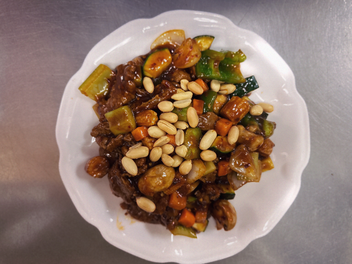 Stir - fried food topped with nuts and mixed vegetables at Chinese #1 Kitchen，a Chinese Restaurant in Chicago