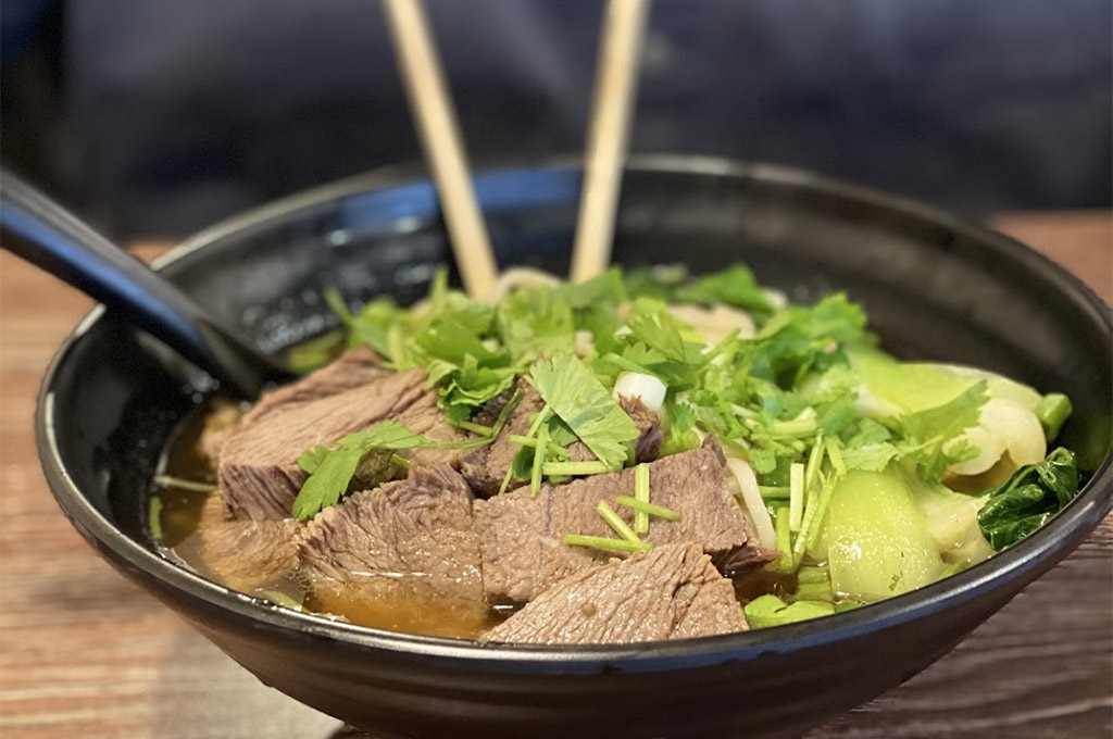 Savory beef broth with tender beef, noodles and veggies at Chinese Dumpling, a Chinese Restaurant in Midland