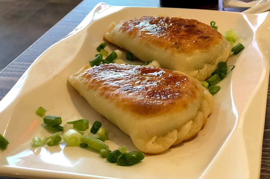Crispy pan-fried dumplings with savory fillings at Chinese Dumpling, a Chinese Restaurant in Midland