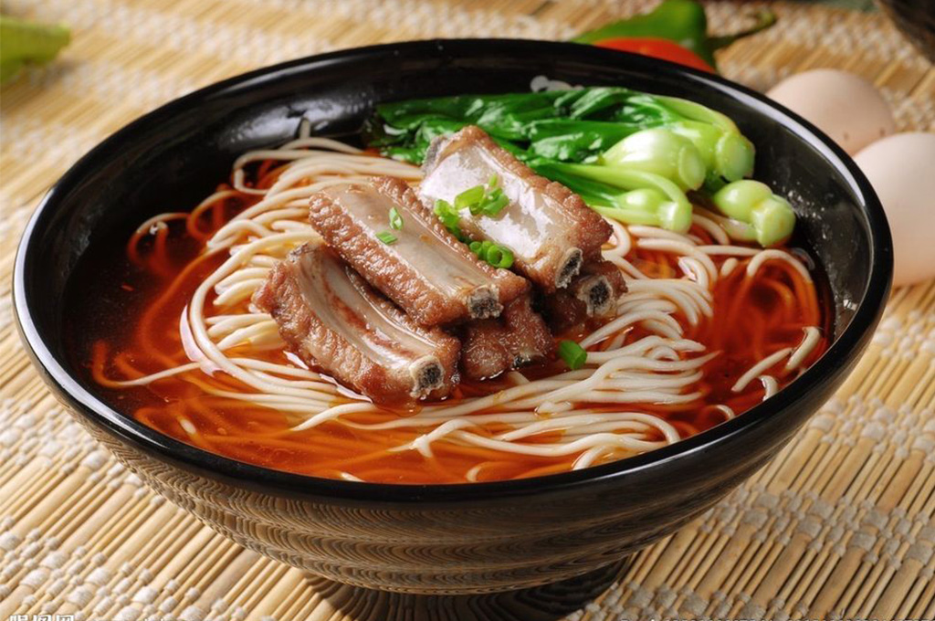 Spicy broth with ribs, noodles and greens at Chinese Dumpling, a Chinese Restaurant in Midland