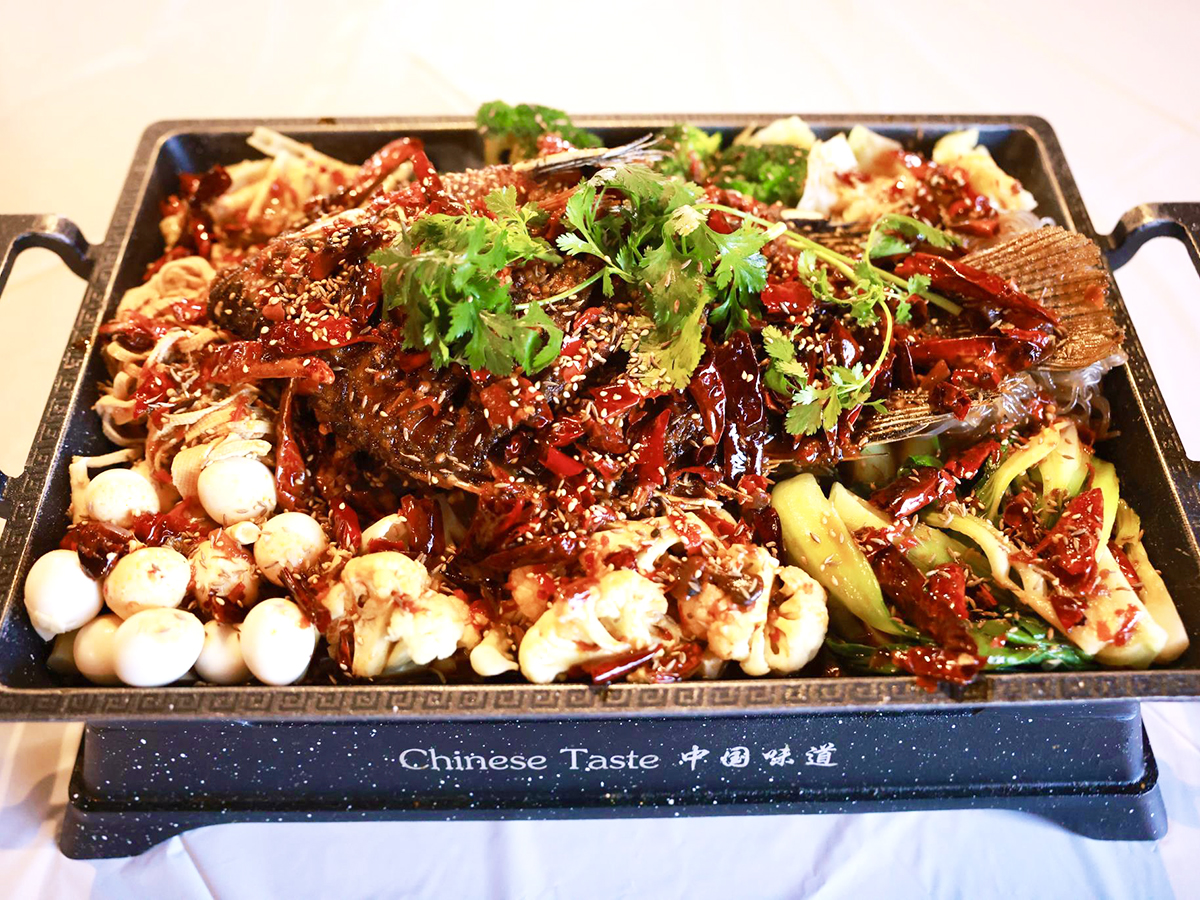 Chinese-Taste-Chinese-Restaurant-Grilled-Fish-Salt-Lake-City Platter of grilled fish with toppings at Chinese Taste,a Chinese Restaurant in Salt Lake City