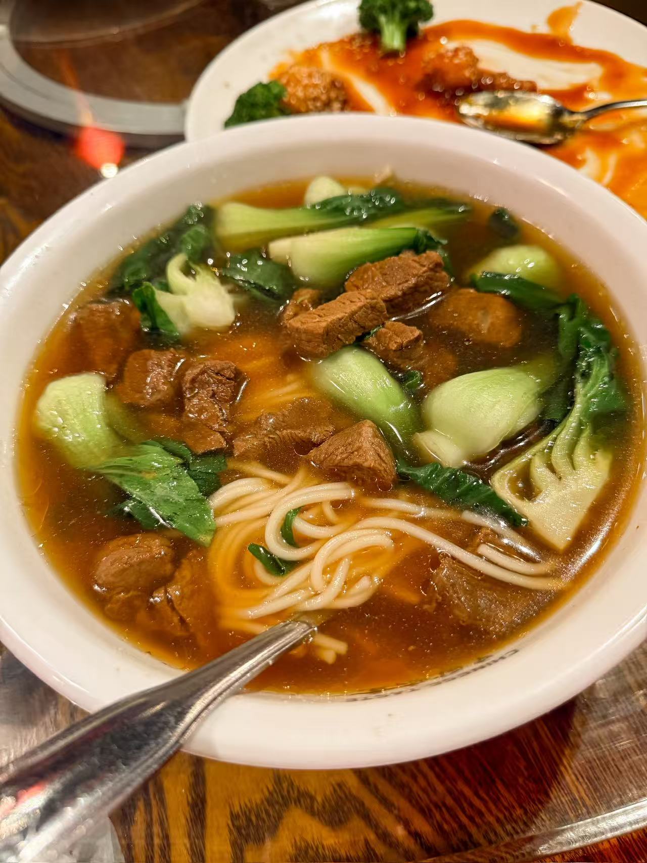 Bowl of braised beef noodle soup with veggies at Chinese Taste，a Chinese Restaurant in Salt Lake City