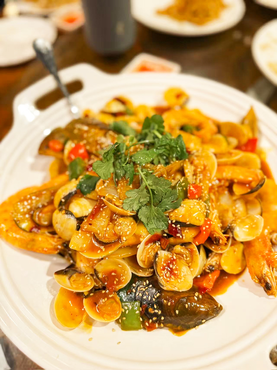 Plate of spicy stir - fried mixed seafood shells at Chinese Taste，a Chinese Restaurant in Salt Lake City