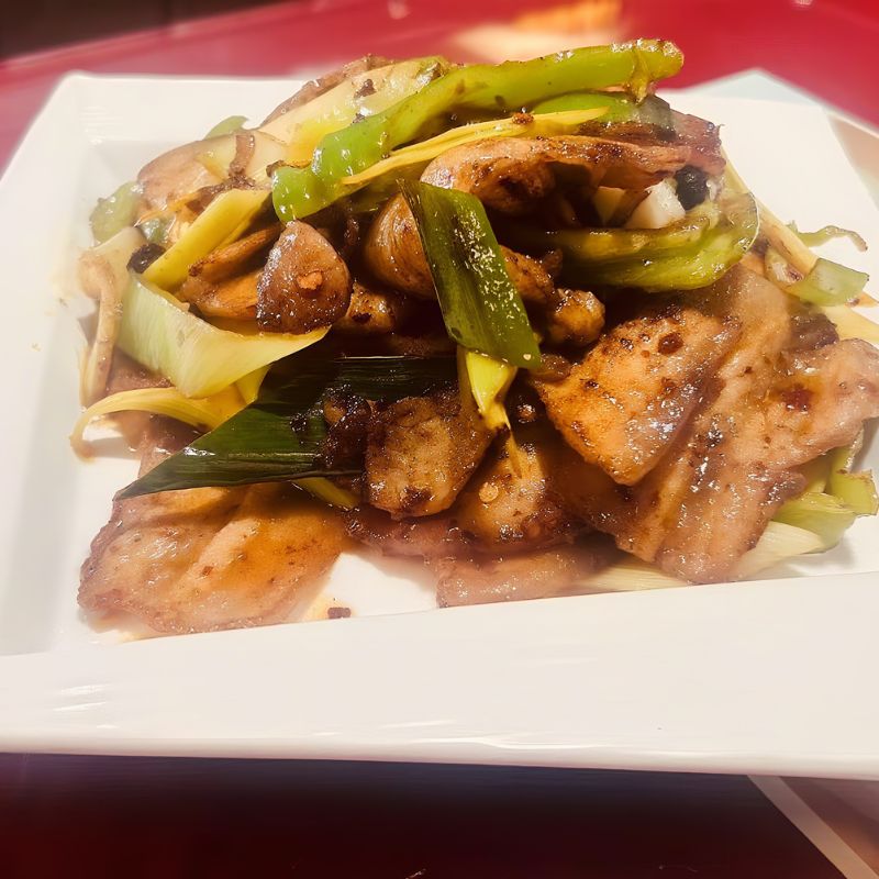 Chong-Qing-Restaurant-Chinese-Restaurant-Garlic-Sprout-and-Cured-Pork-East-Providence Cured pork stir - fried with garlic sprouts.