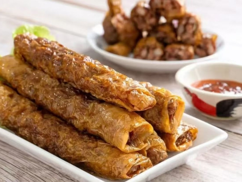 meat rolls with dipping sauce at Noodle Time, a Chinese Restaurant in Flushing