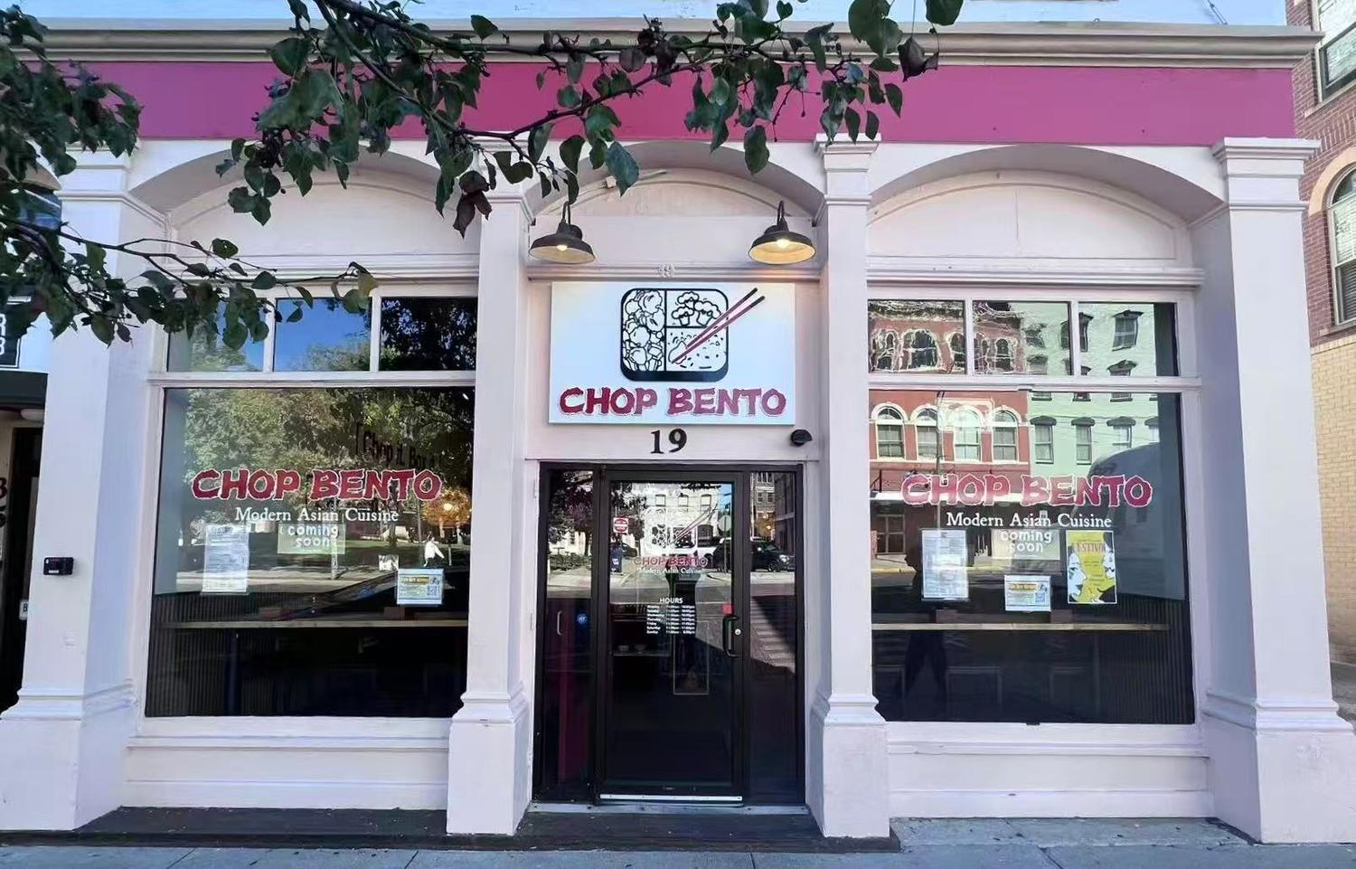 Chop-Bento-Asian-Restaurant-Oxford Storefront for "CHOP BENTO" modern Asian cuisine restaurant, with a light pink and white facade and "COMING SOON" signs in the windows.