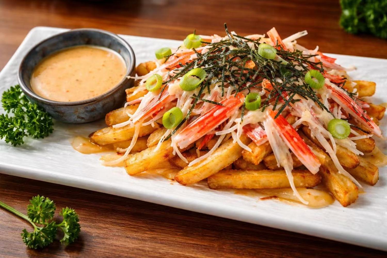 Loaded fries topped with crab shreds, seaweed and green onions with dipping sauce at Golden Dragon Restaurant a Chinese Restaurant in East Troy