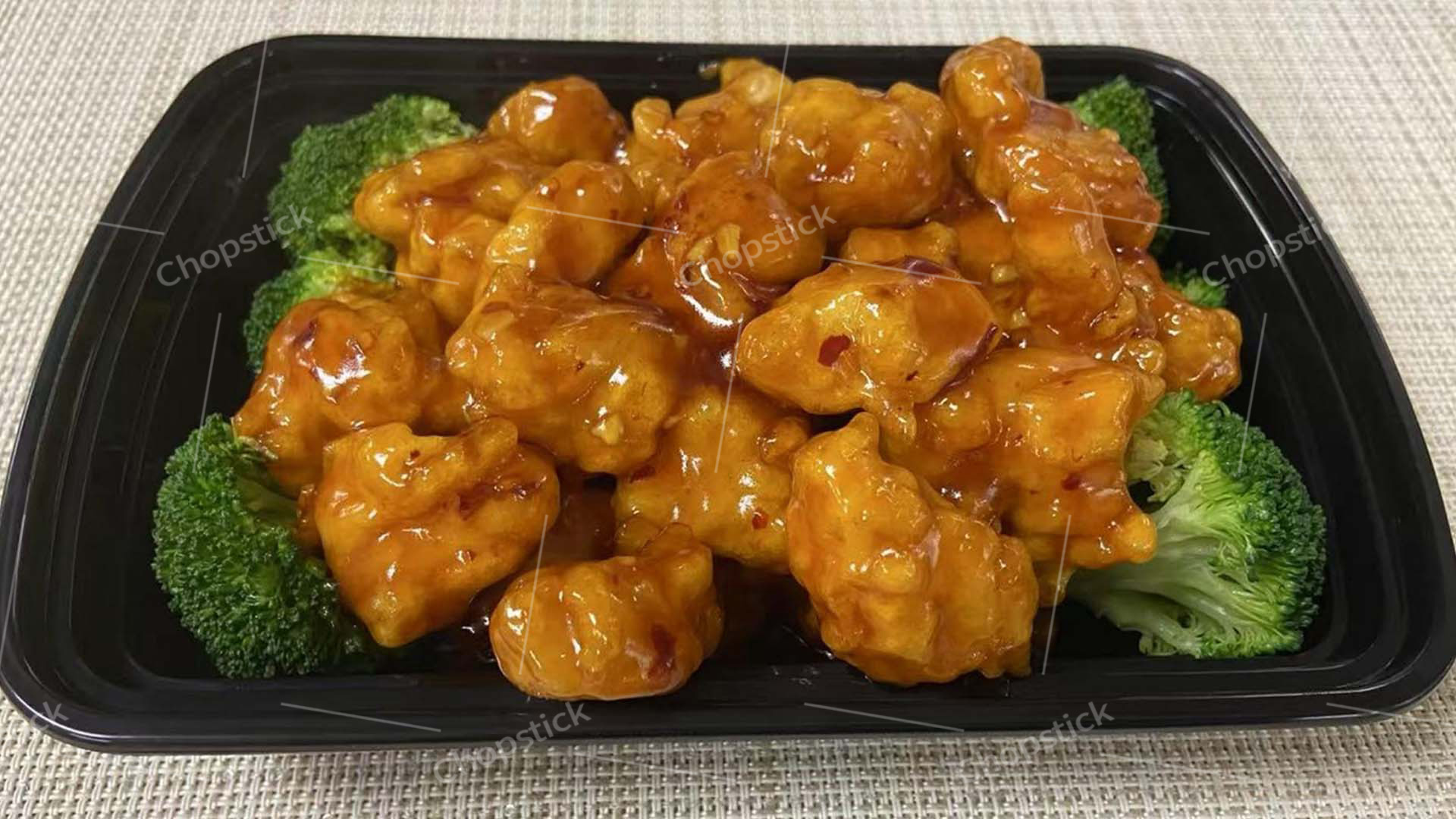 General Tso's chicken with broccoli in takeout container at Chopstick, a Chinese Restaurant in Flowood
