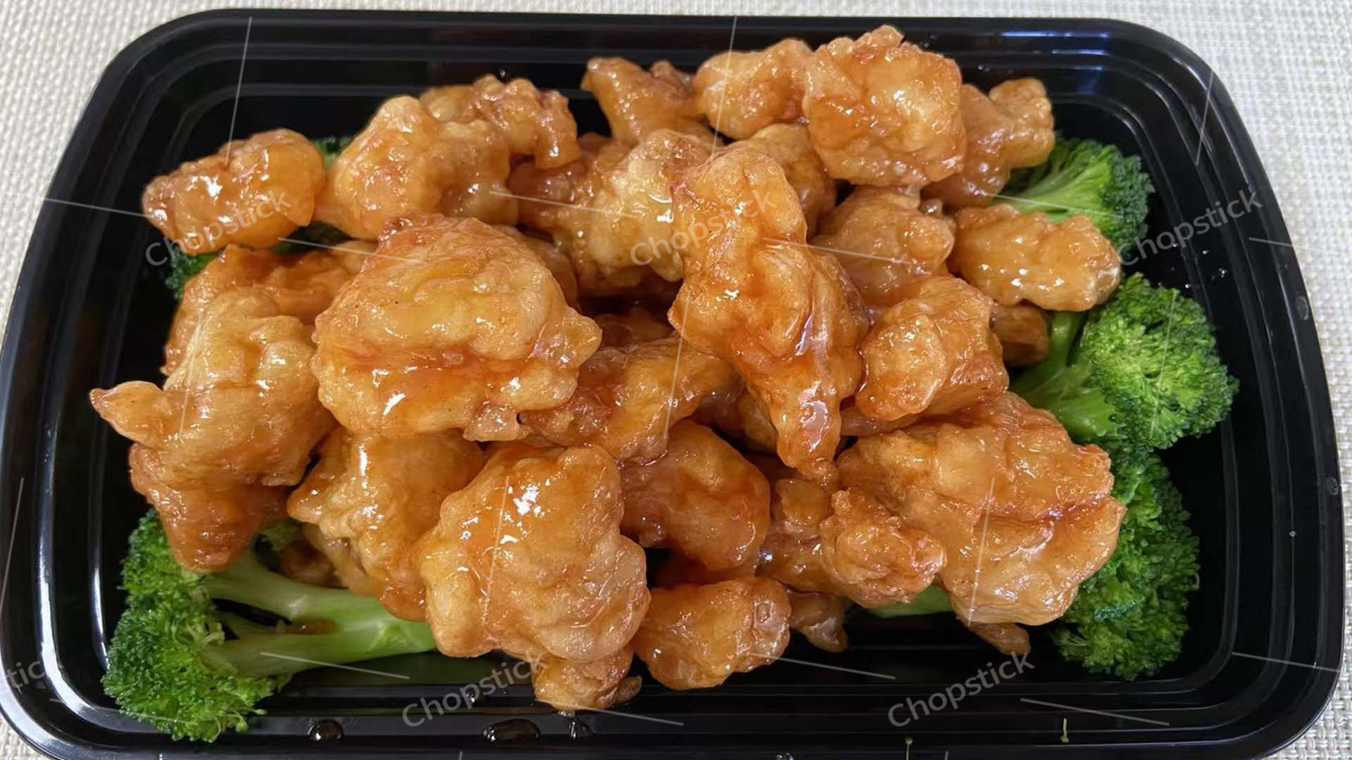 Honey chicken with broccoli in takeout container at Chopstick, a Chinese Restaurant in Flowood