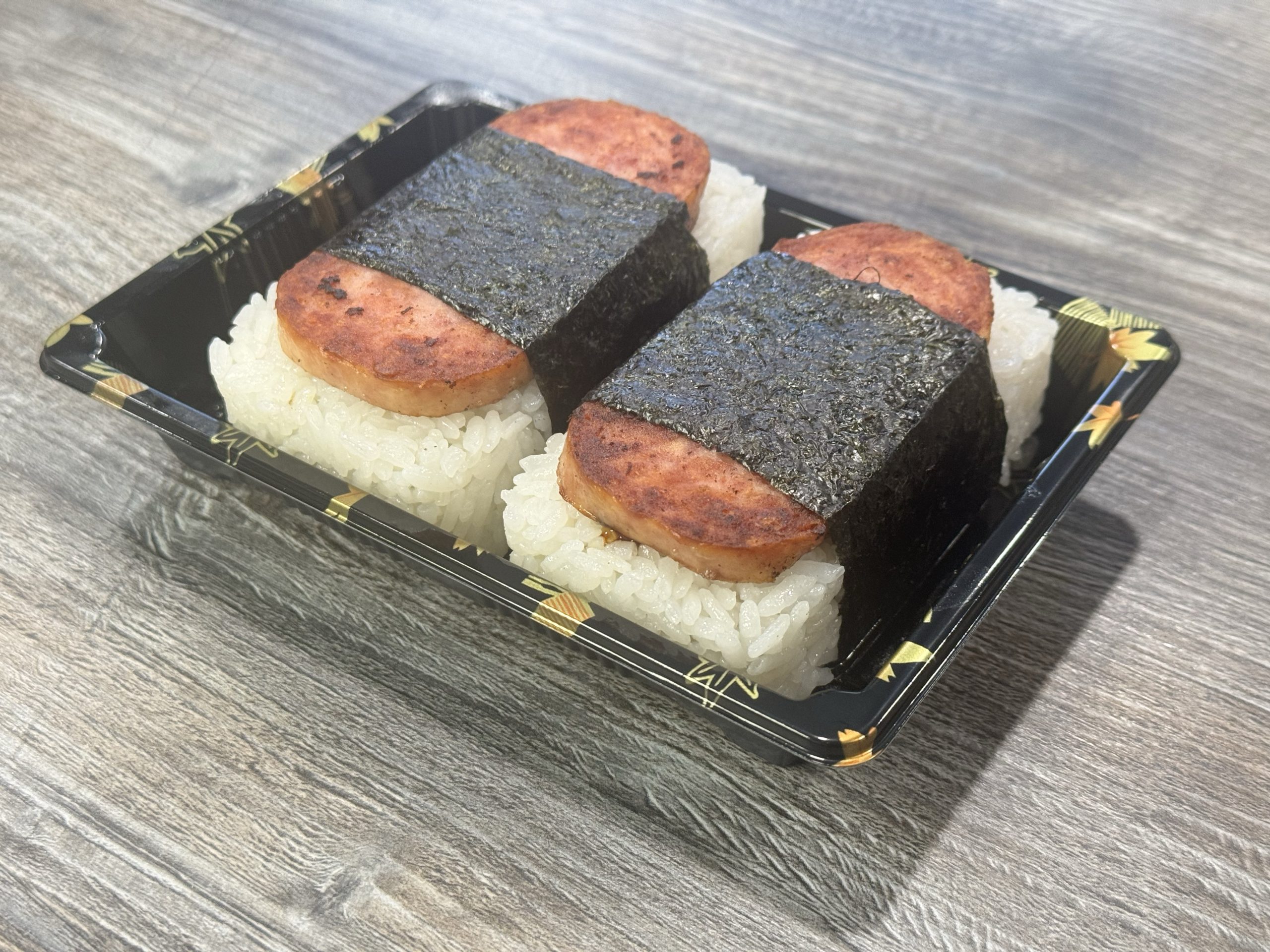 Grilled spam over rice wrapped in seaweed at Chop Sushi & Grill, a Japanese Restaurant in Los Angeles