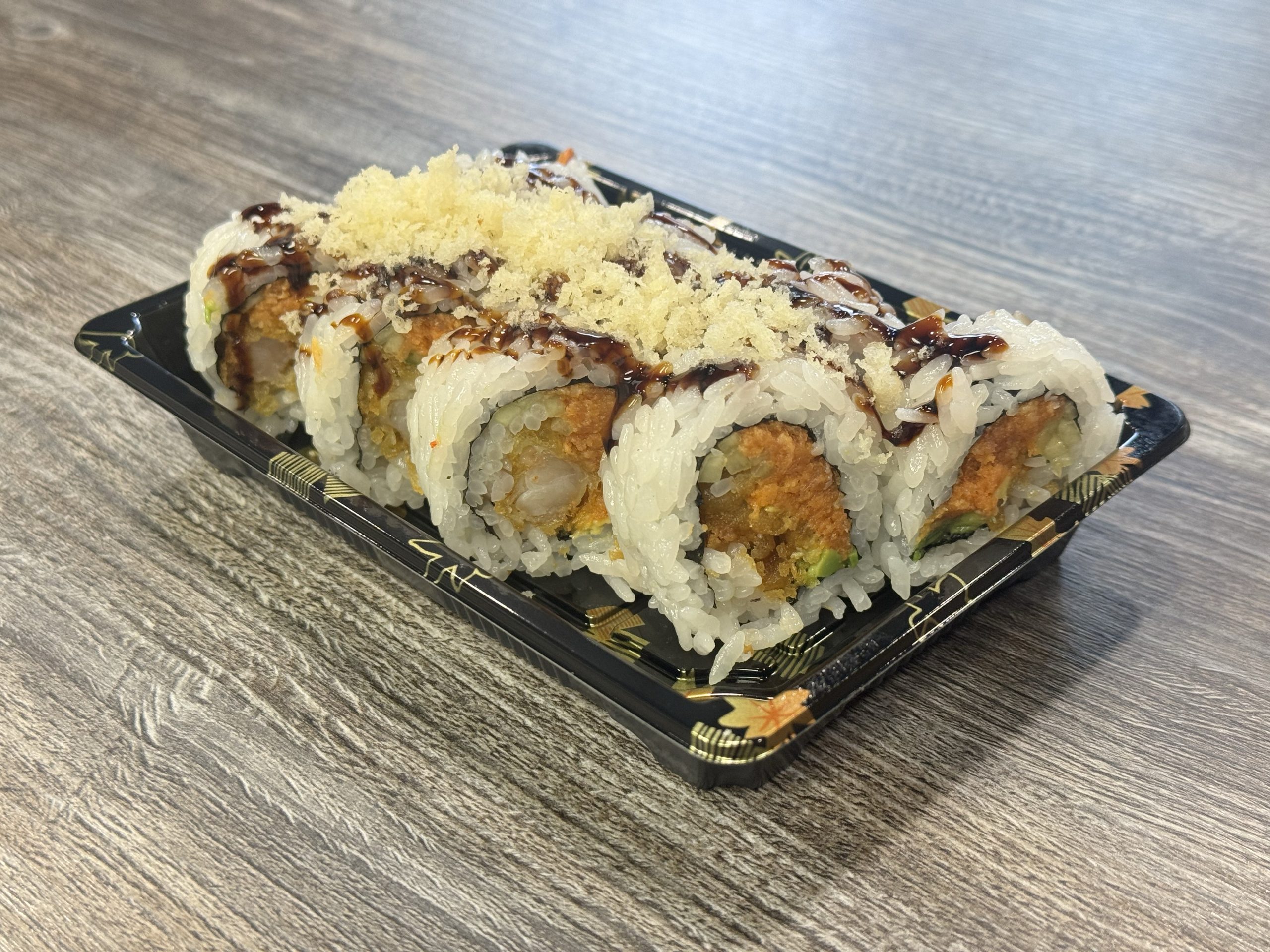 Tempura shrimp and avocado maki with sauce at Chop Sushi & Grill, a Japanese Restaurant in Los Angeles