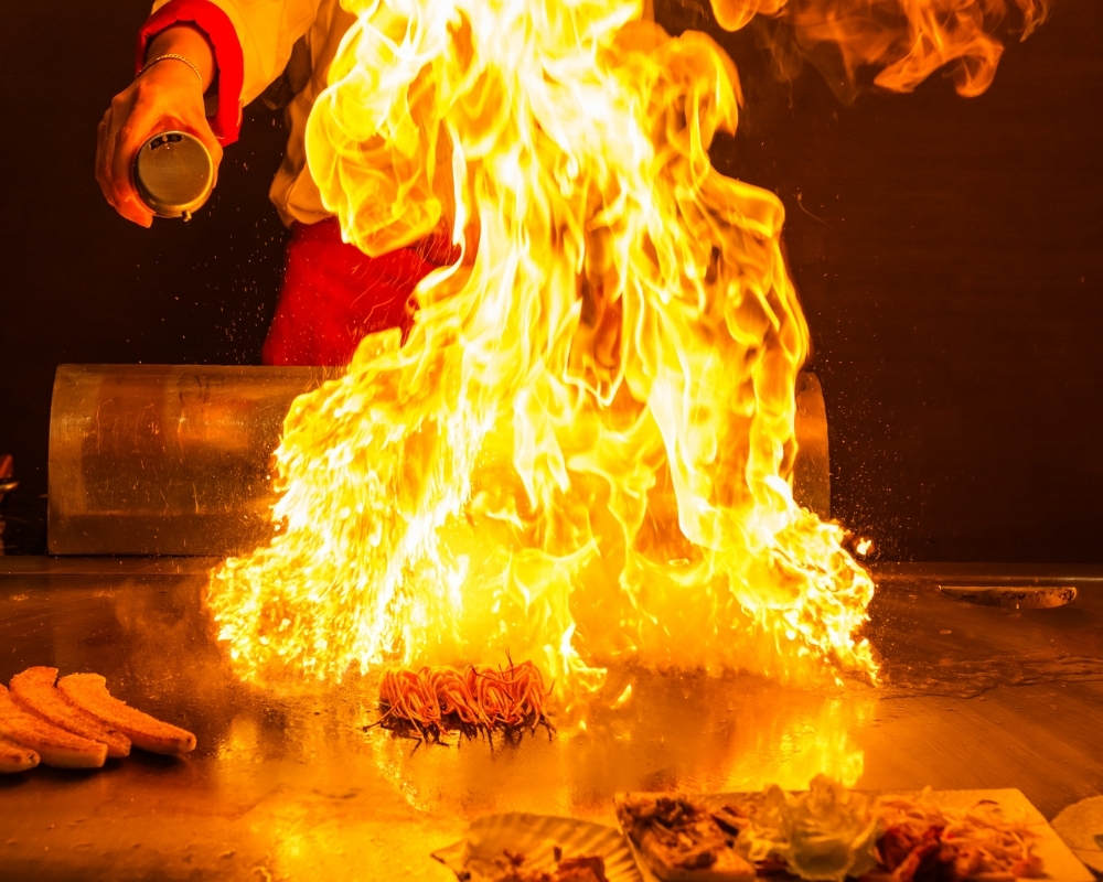 Dramatic hibachi fire show with noodles at Chow's Ramen & Hibachi, a Authentic Japanese Restaurant Chandler