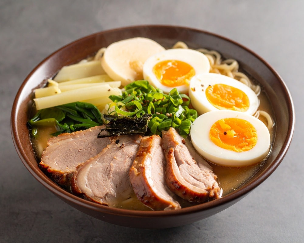 Rich ramen with extra chashu, eggs, and greens at Chow's Ramen & Hibachi, a Authentic Japanese Restaurant Chandler