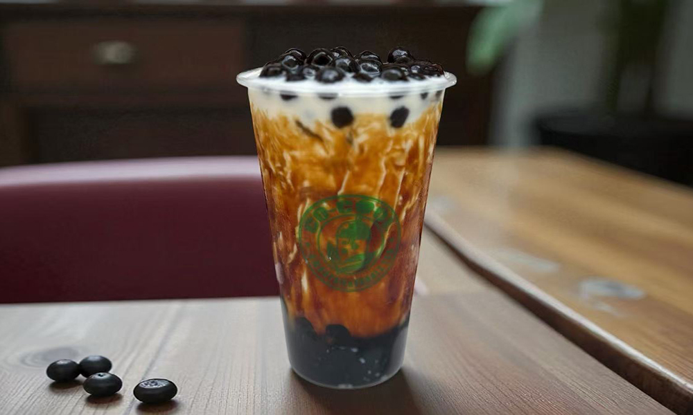 Rich brown sugar bubble tea with black pearls and creamy layers at Co-cool Smoothie & Bubble Tea, a Bubble Tea Shop in Freehold