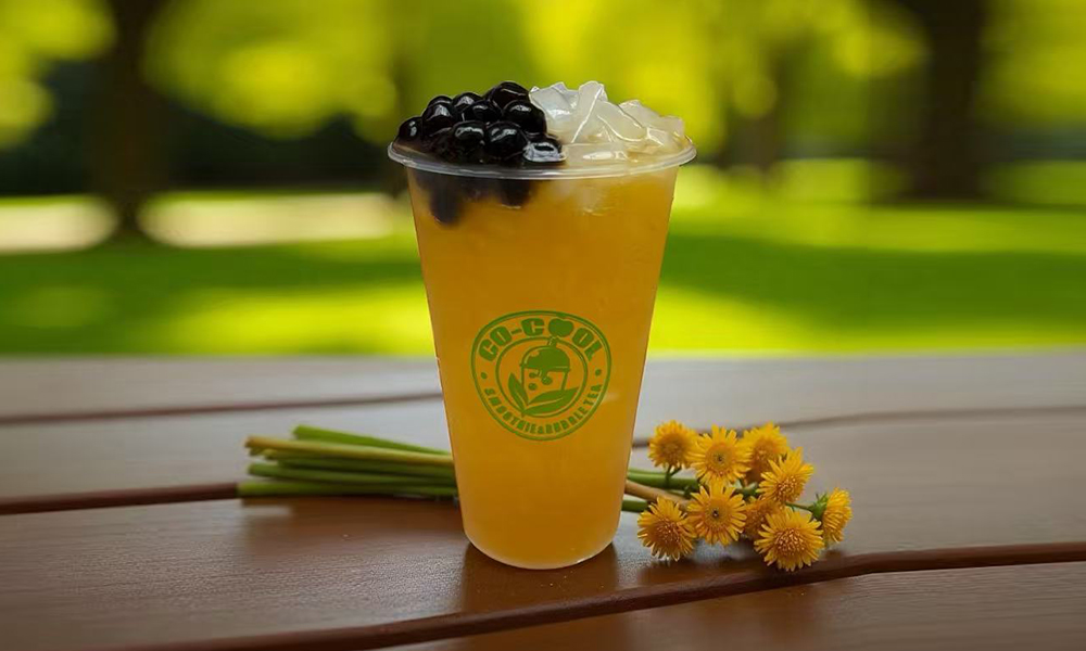 Co-cool-Smoothie-&-Bubble-Tea-Bubble-Mango-Pearl-Fruit-Tea-Freehold Vibrant mango fruit tea with black pearls and ice at Co-cool Smoothie & Bubble Tea, a Bubble Tea Shop in Freehold