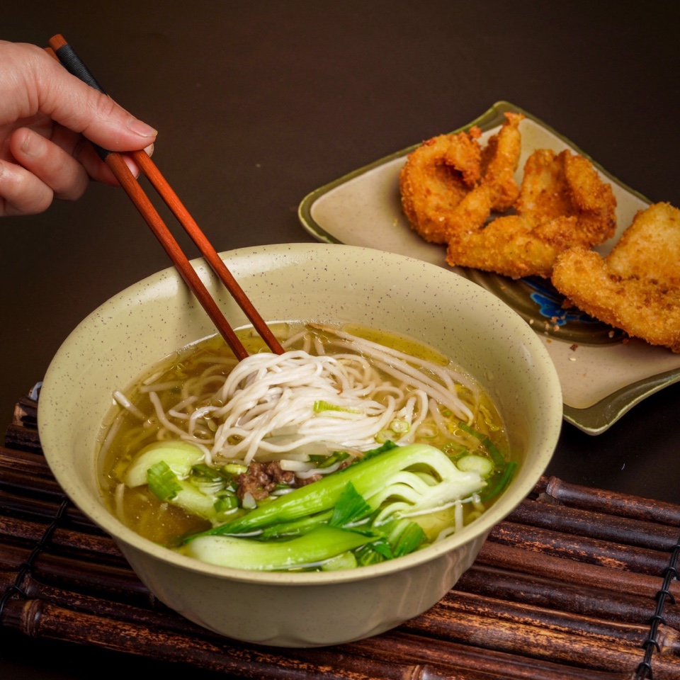 Meat noodle soup served with fried shrimp at Coco's Cafe, a Chinese Taiwanese Restaurant in Sugar Land
