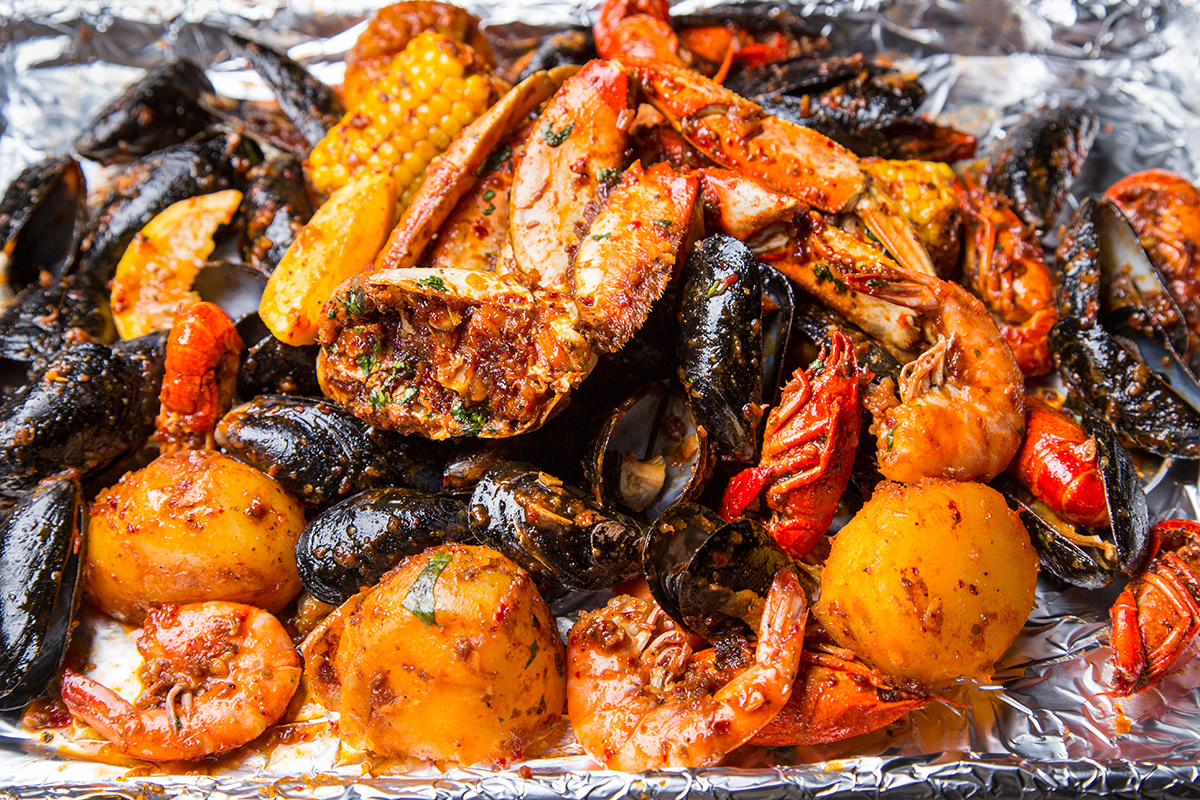 Spicy seafood boil with crab shrimp mussels and potatoes at Crabbers No.12, a Seafood Restaurant in Orlando