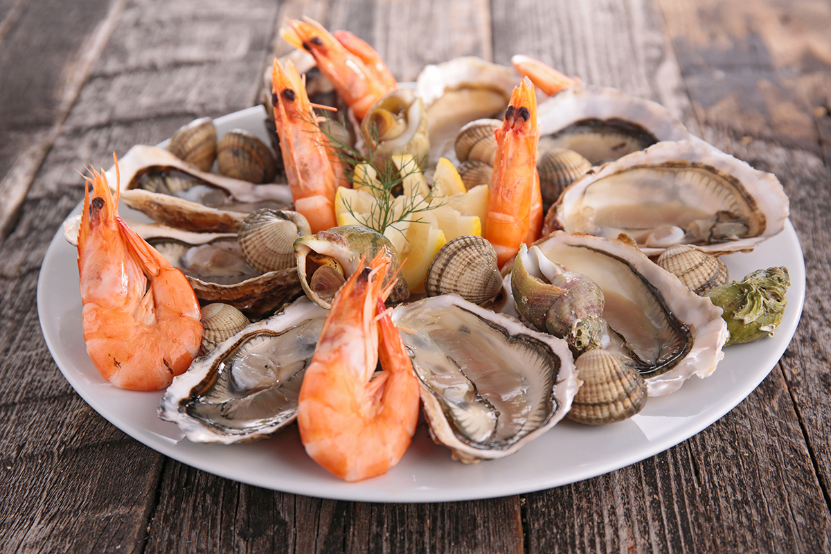 Fresh raw seafood platter with oysters shrimp and clams at Crabbers No.12, a Seafood Restaurant in Orlando