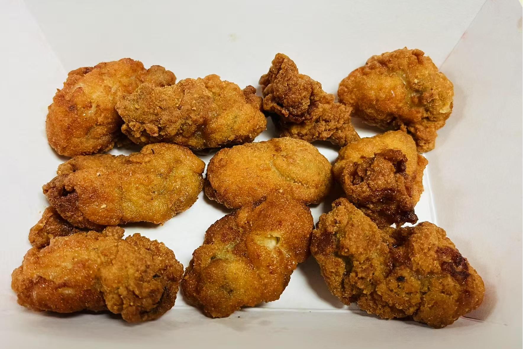 Crispy Fried Chicken Bites Golden, crunchy chicken pieces in a box