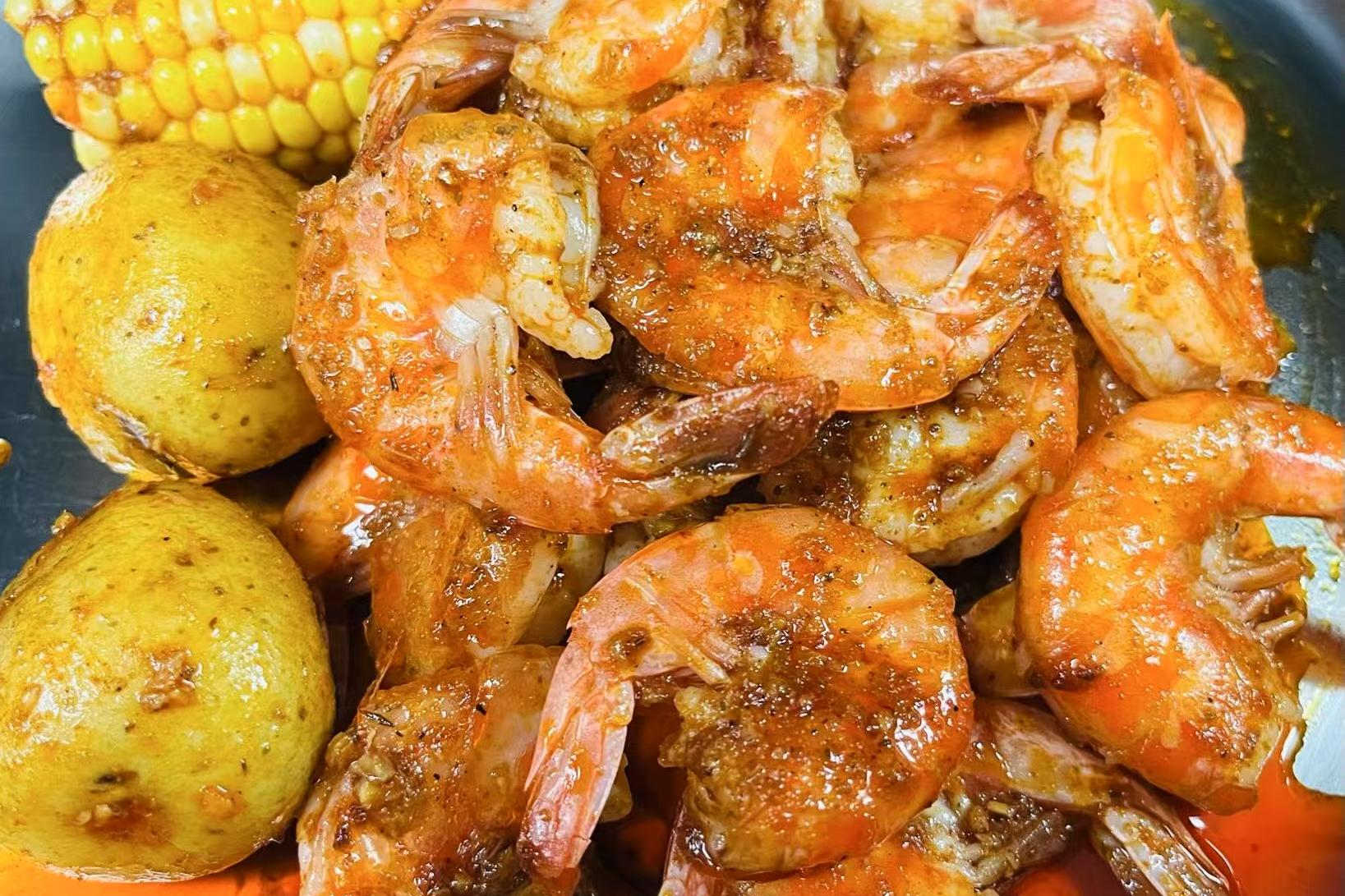 Spiced shrimp cooked with potatoes and corn at Crabbers, a Seafood restaurant in Sarasota