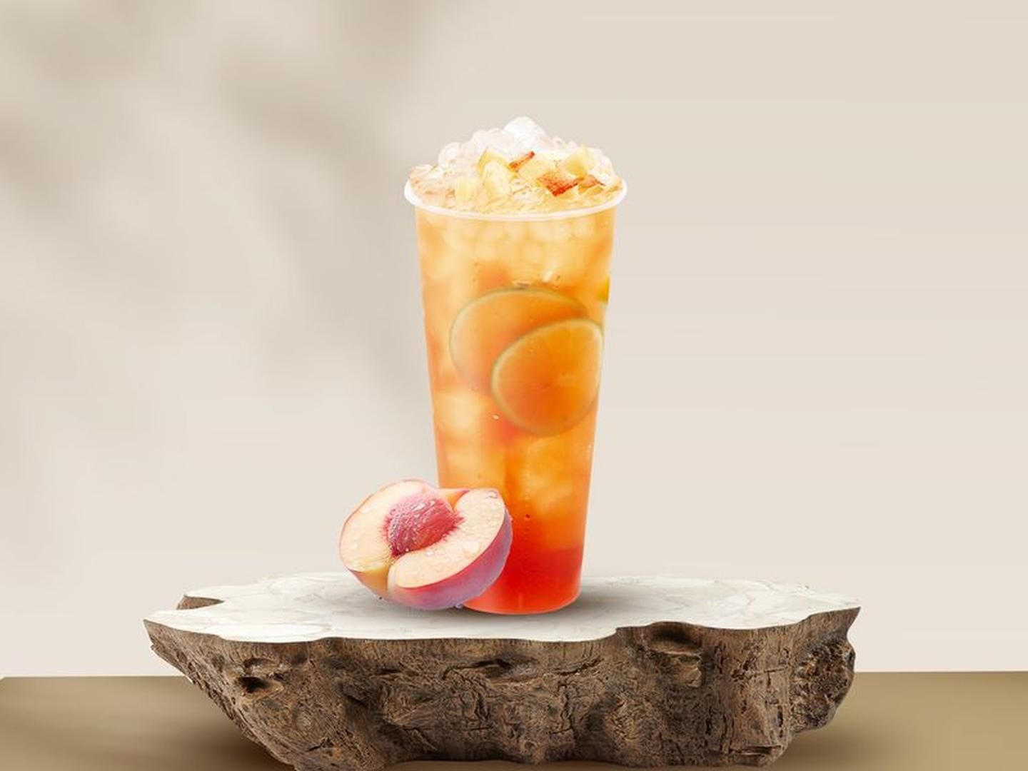 Peach blossoms green tea with peach slices at Crispy Burger, a Fast - Food Restaurant in Cut Off