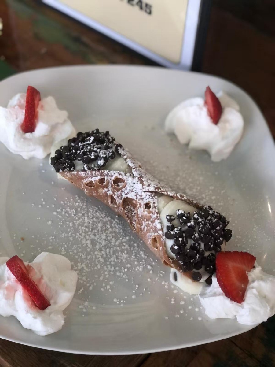 Cannoli with cream and strawberry toppings at DA DAMASO，a Italian Restaurant in Staten Island