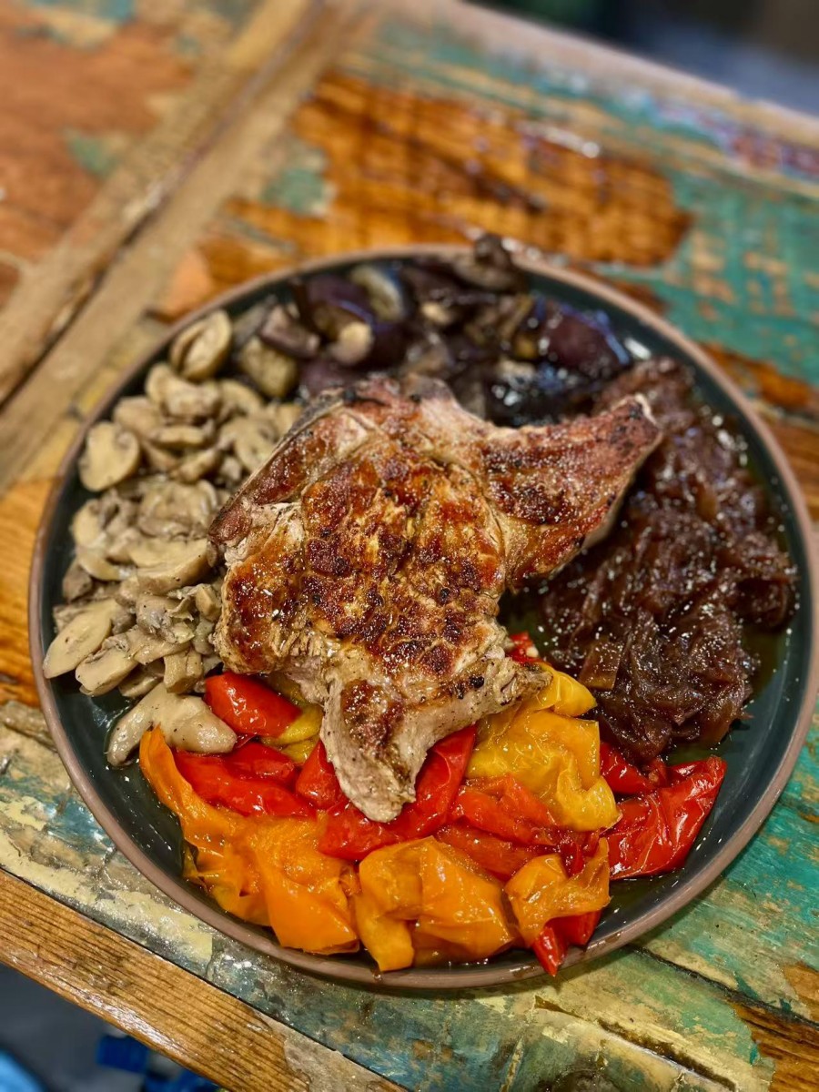 Cooked pork chop with assorted vegetables at DA DAMASO，a Italian Restaurant in Staten Island