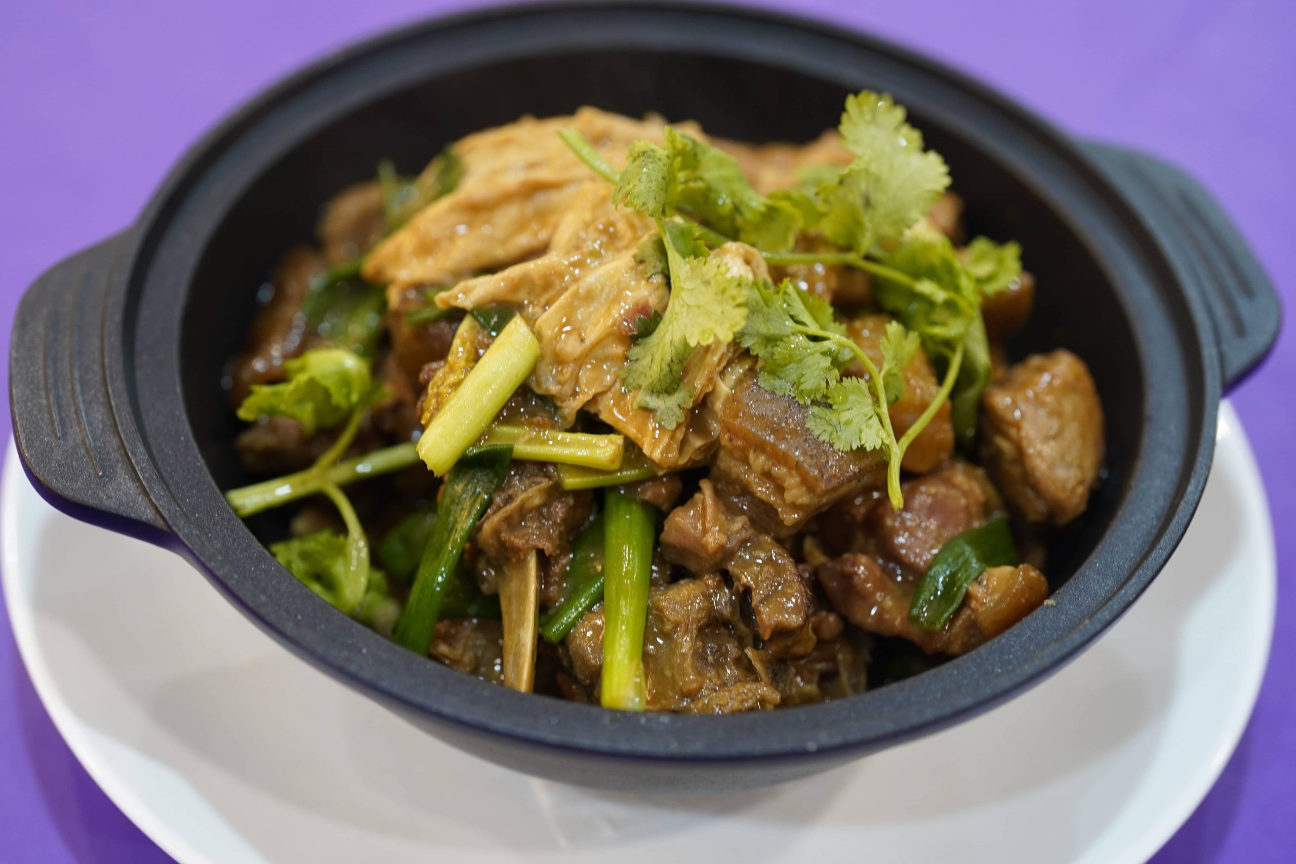 Lamb clay pot with cilantro and tofu skin at Dak Sing Palace, a Chinese Restaurant in Brooklyn