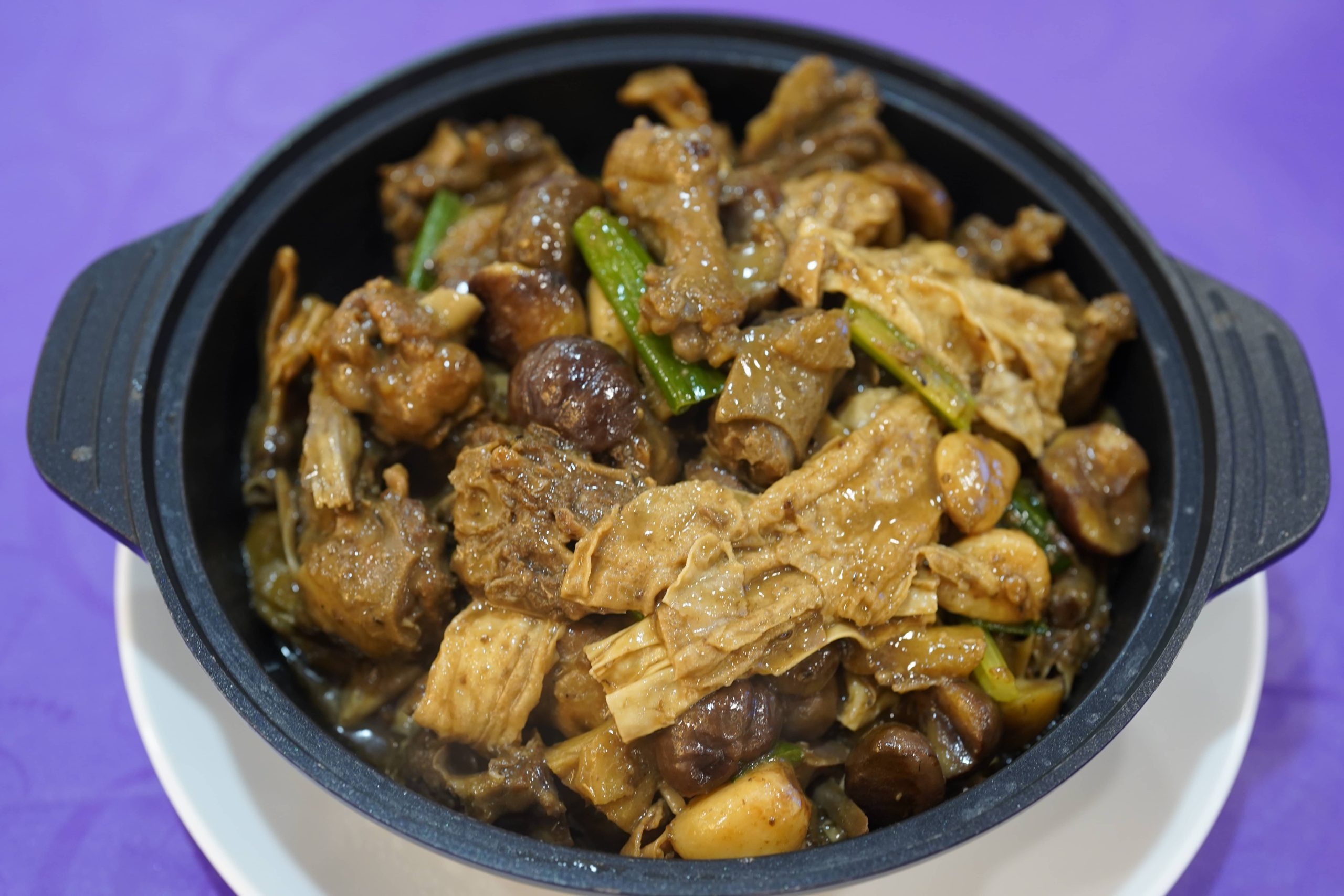 Chicken clay pot with chestnuts and tofu skin at Dak Sing Palace, a Chinese Restaurant in Brooklyn