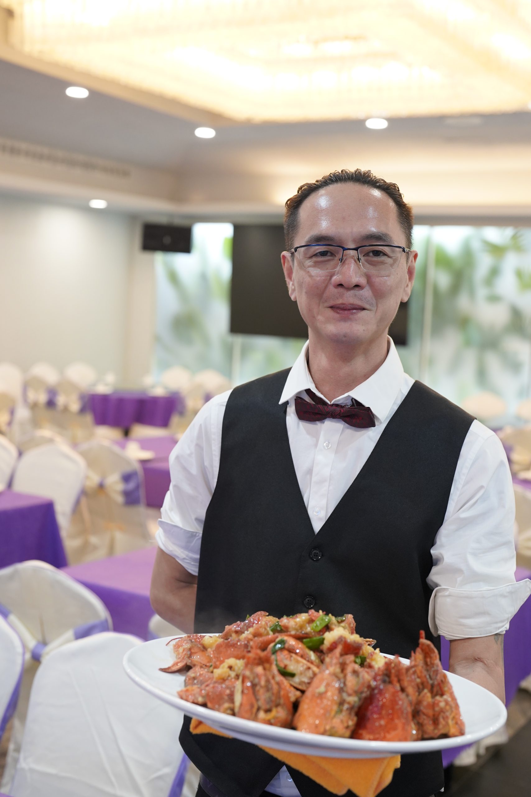 Garlic lobster with green onion, served by hotel manager at Dak Sing Palace, a Chinese Restaurant in Brooklyn
