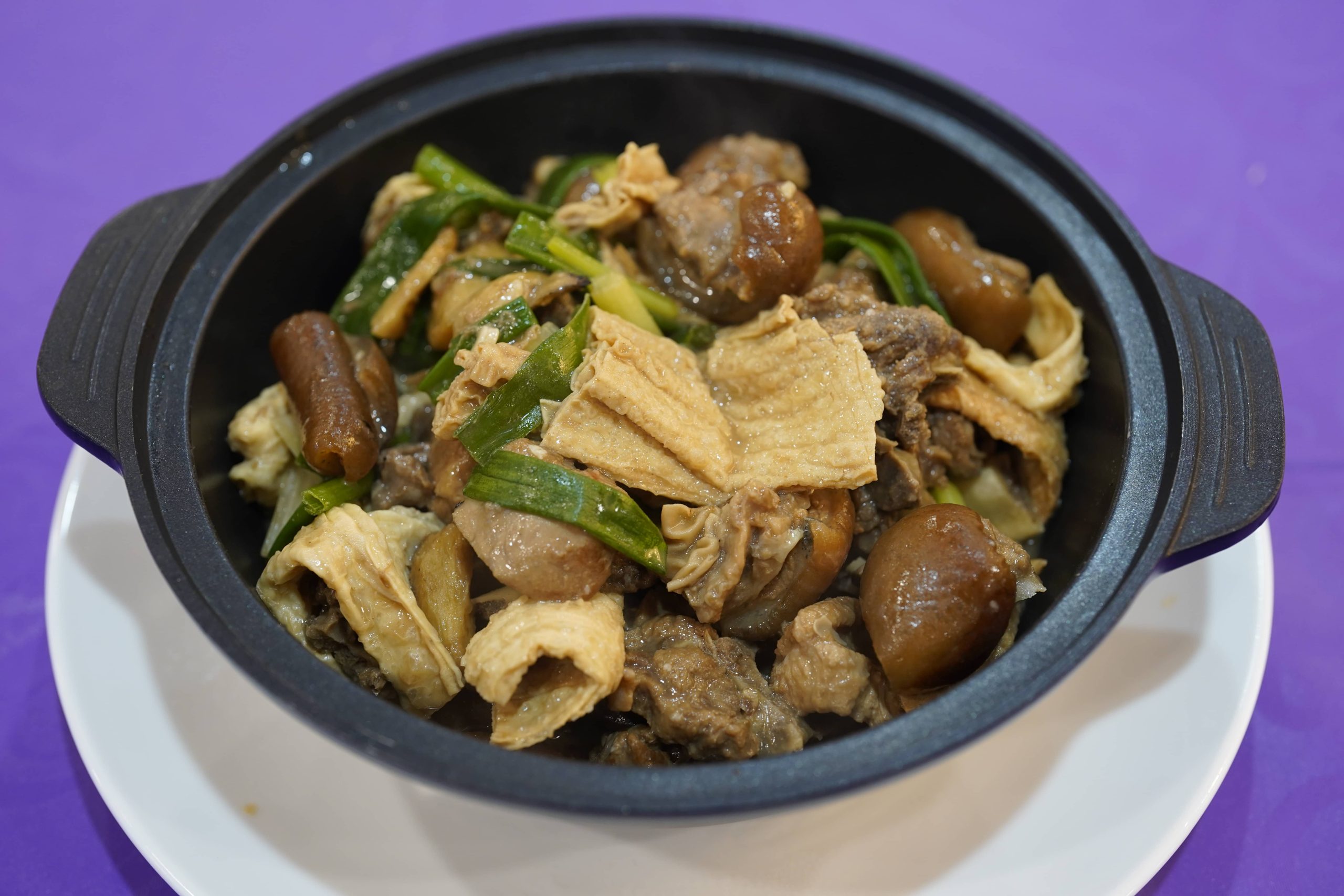 Lamb clay pot with tofu skin and green onion at Dak Sing Palace, a Chinese Restaurant in Brooklyn