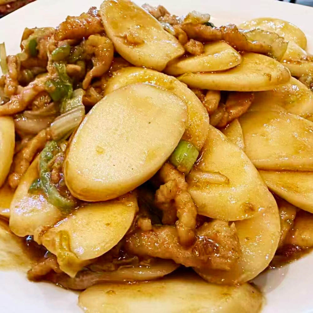 Stir-fried rice cake with cabbage at Dallas Spicy Chinese Cuisine, a Chinese Restaurant in Plano.