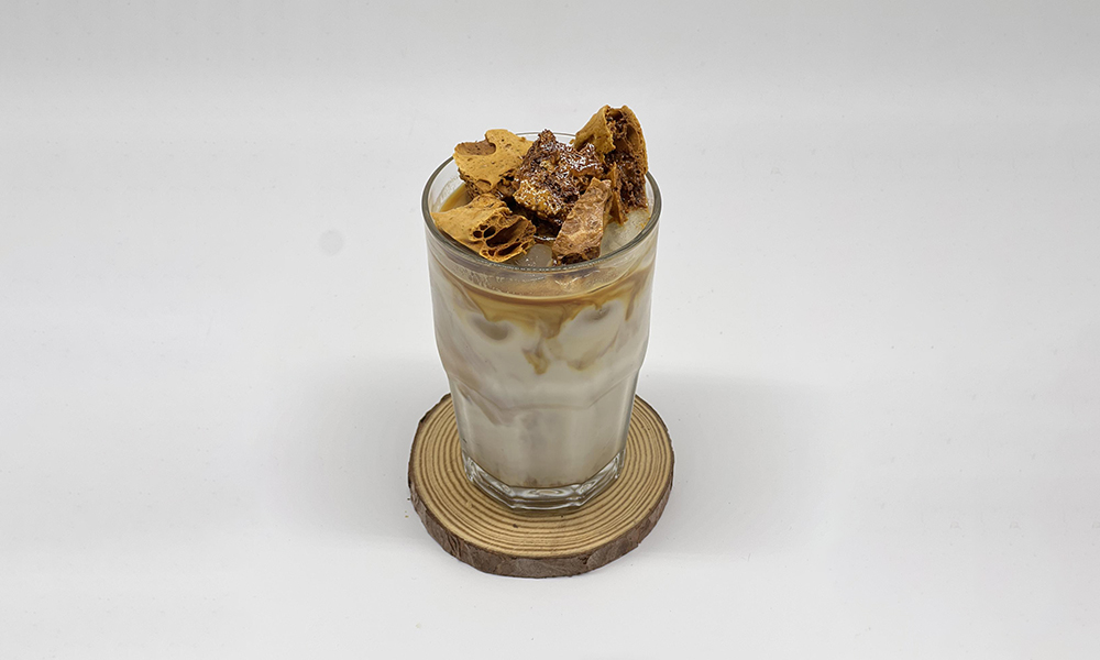 coffee topped with honeycomb pieces at Dandelion Kaffe，a Brunch Restaurant in Alameda