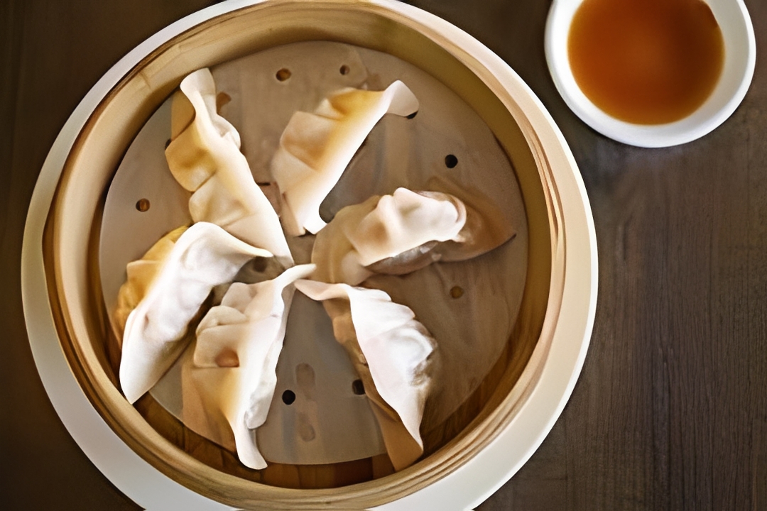 Steamed dumplings served with dipping sauce at Dan Zai Ramen & Sushi House, a Asian Fusion Restaurant in Green Brook Township