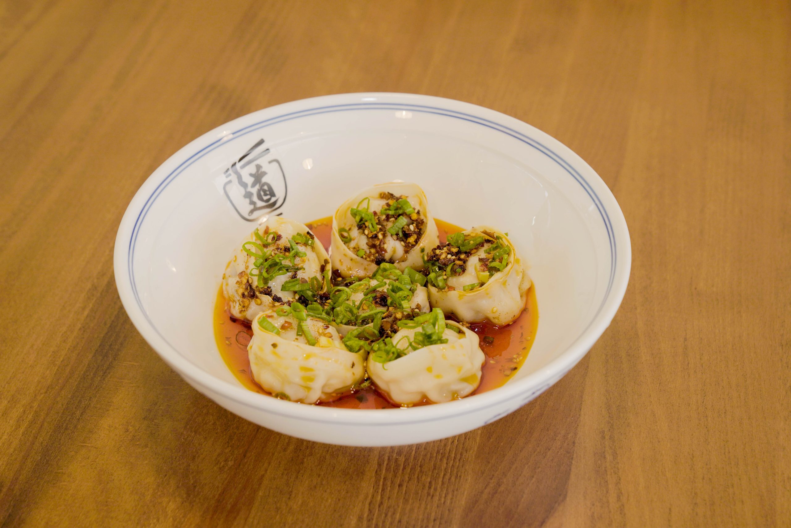 Dumplings in spicy sauce with scallions at Dao Artisan Noodle, a Chinese Restaurant in San Leandro