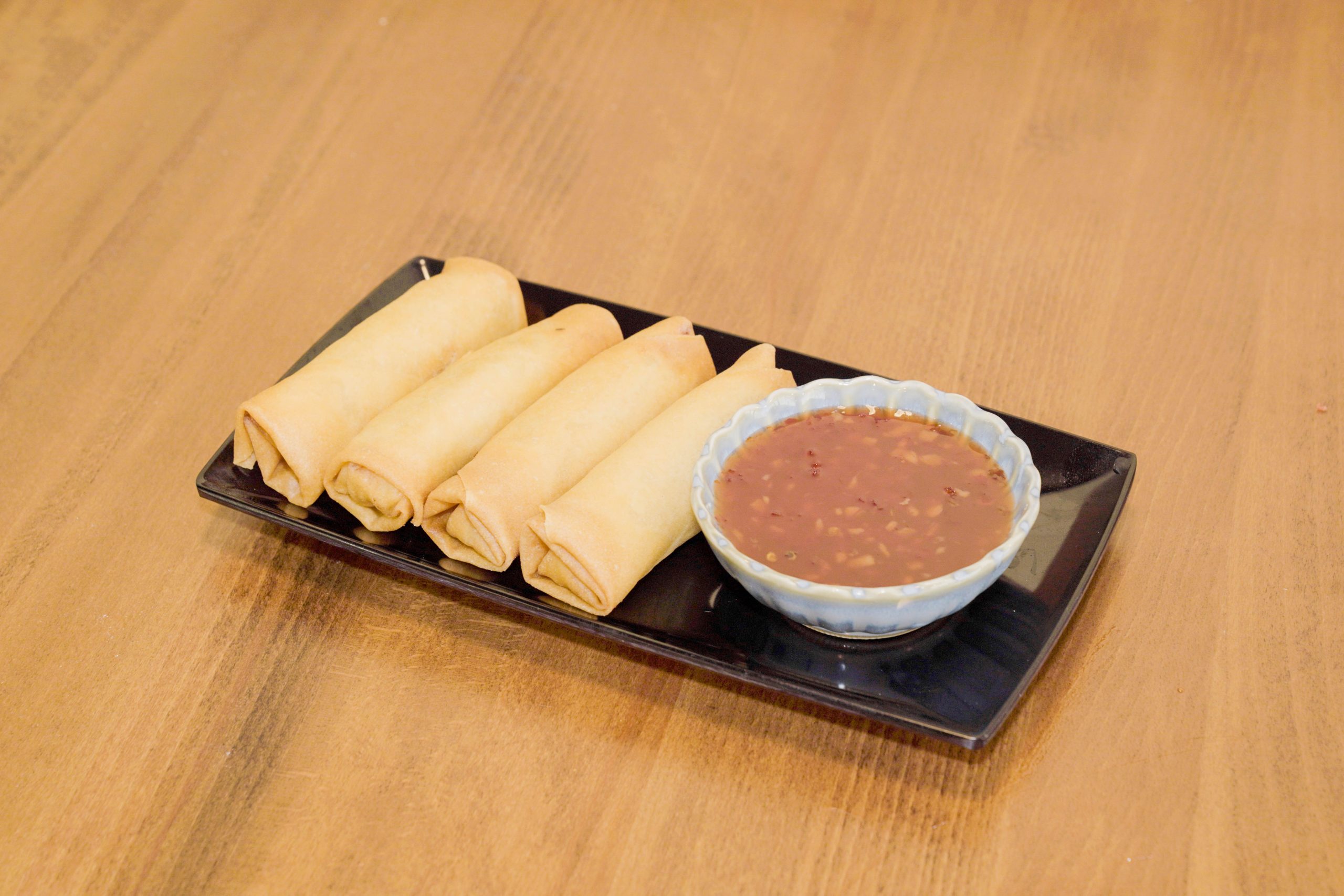 Crispy spring rolls served with savory dipping sauce at Dao Artisan Noodle, a Chinese Restaurant in San Leandro
