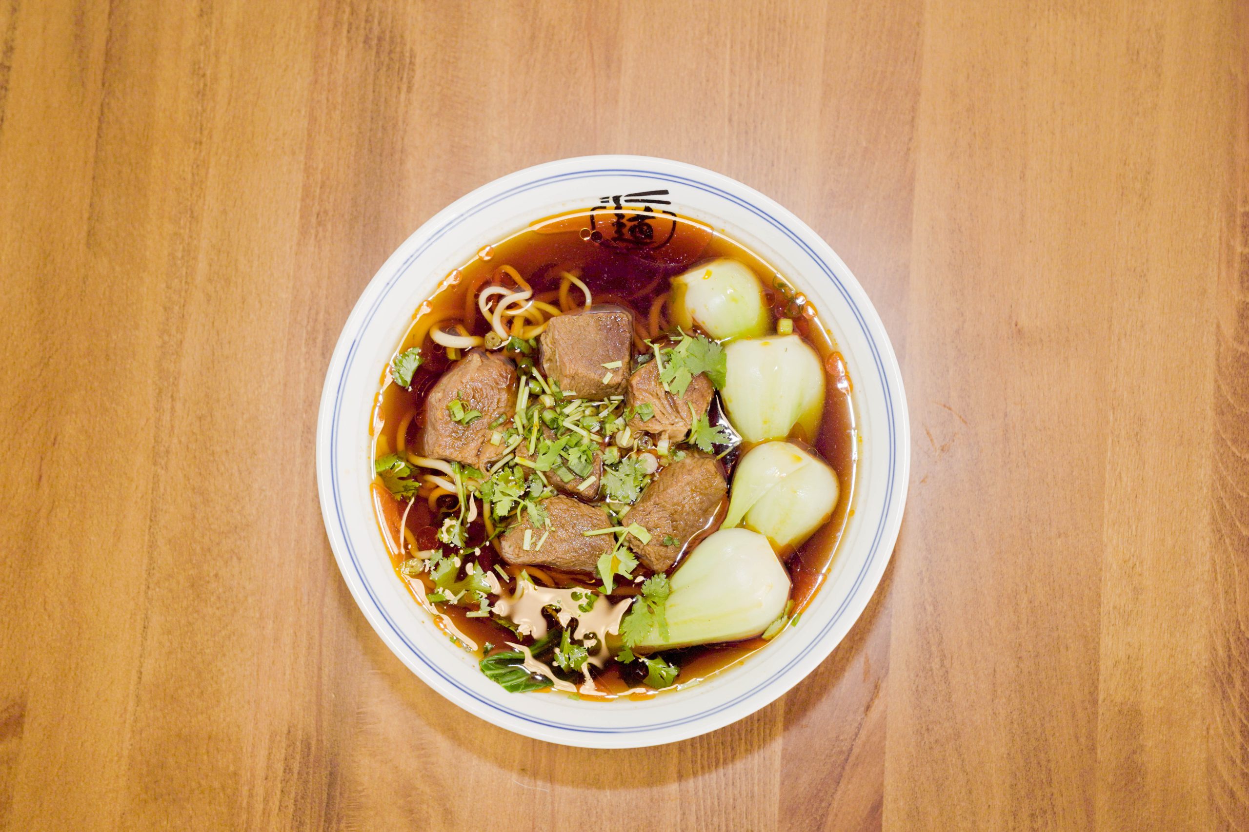 Rich beef noodle soup with tender beef chunks and bok choy at Dao Artisan Noodle, a Chinese Restaurant in San Leandro