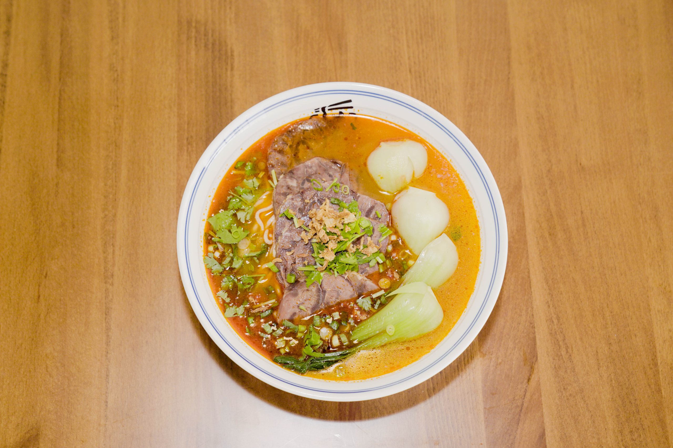 Sour soup beef noodles with rich broth, beef, and bok choy at Dao Artisan Noodle, a Chinese Restaurant in San Leandro