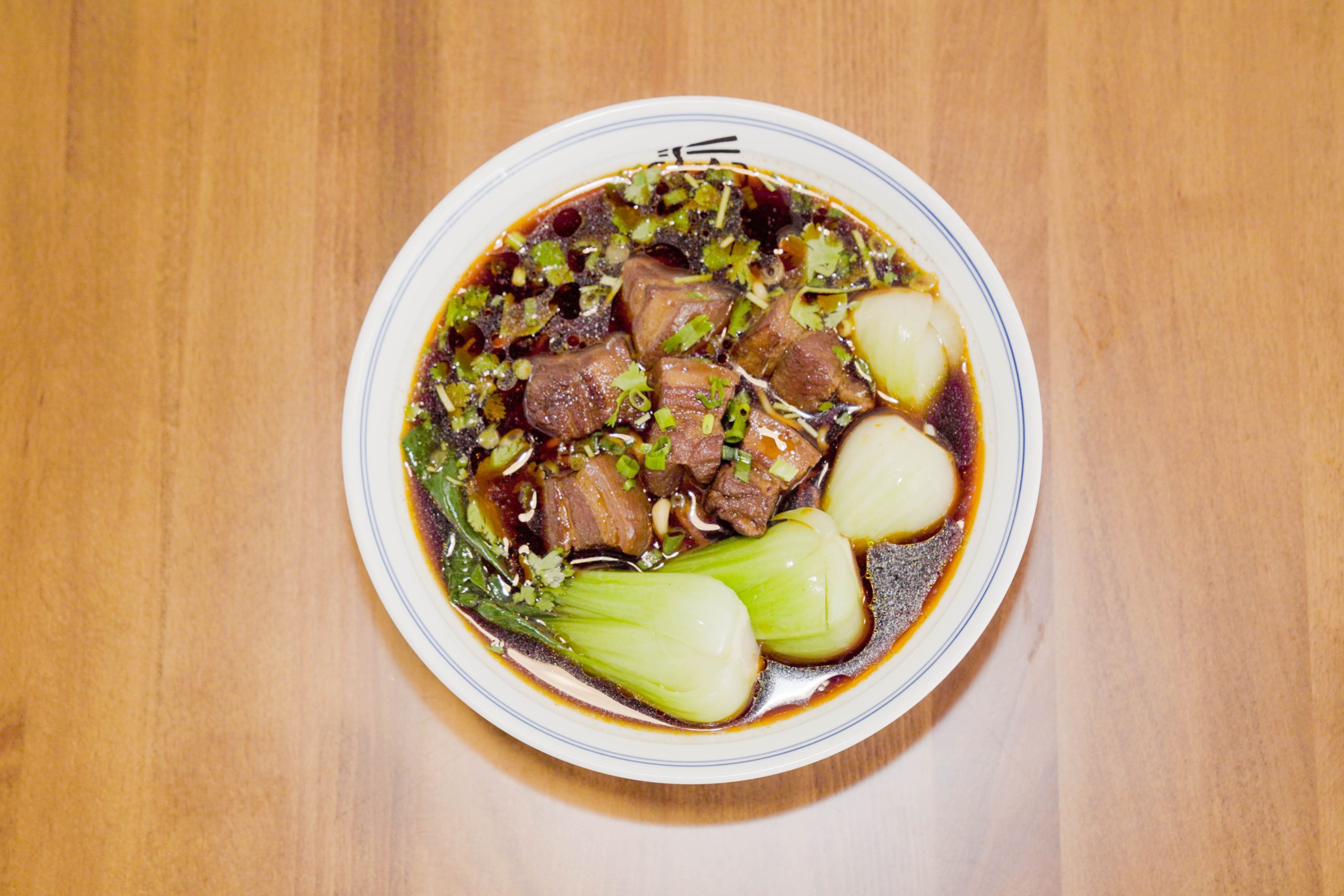 Braised pork belly noodles in savory broth with bok choy at Dao Artisan Noodle, a Chinese Restaurant in San Leandro