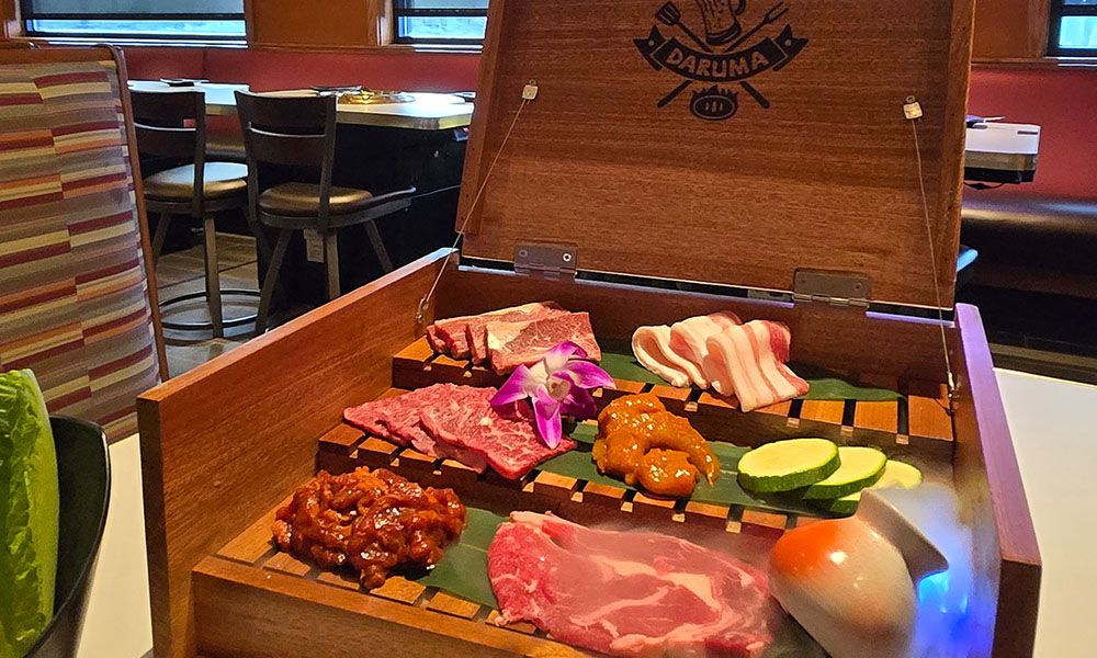 Assorted BBQ meats served in a wooden platter at Daruma Japanese BBQ & Sushi AYCE, a Japanese Restaurant in Holyoke