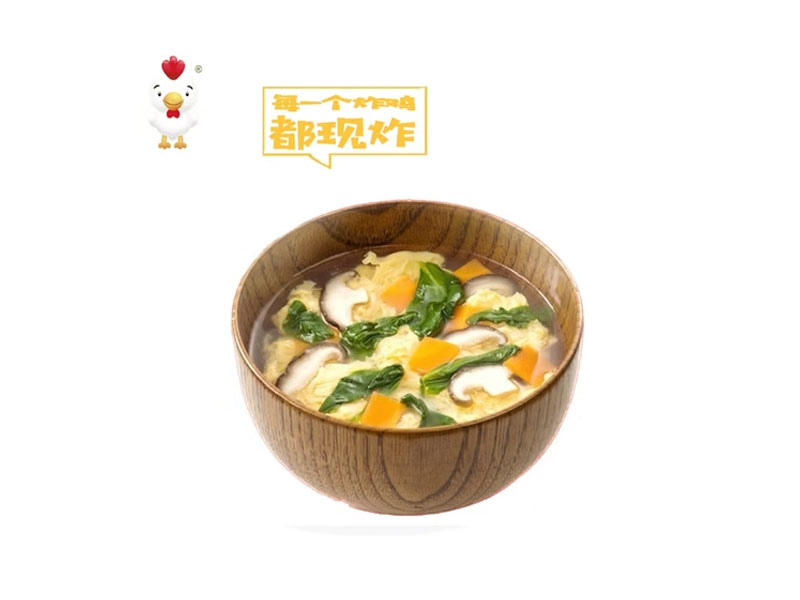 Hot vegetable egg drop soup served inside wooden soup bowl at Delicious Fried, a Fast‑food Restaurant in Los Angeles