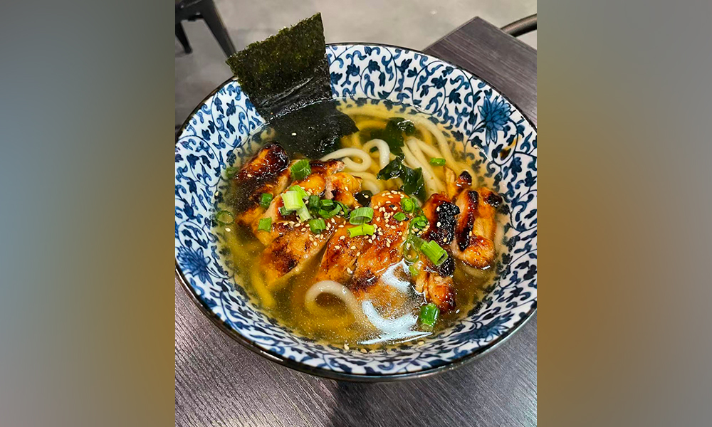 Grilled chicken with udon noodles in a savory soup, a hearty bowl at Devils Kitchen & Teppan, a Asian Restaurant in Eastvale