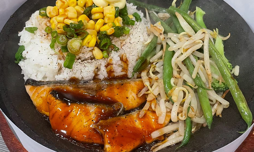 Salmon teriyaki with rice and veggies, a delicious teppan dish at Devils Kitchen & Teppan, a Asian Restaurant in Eastvale