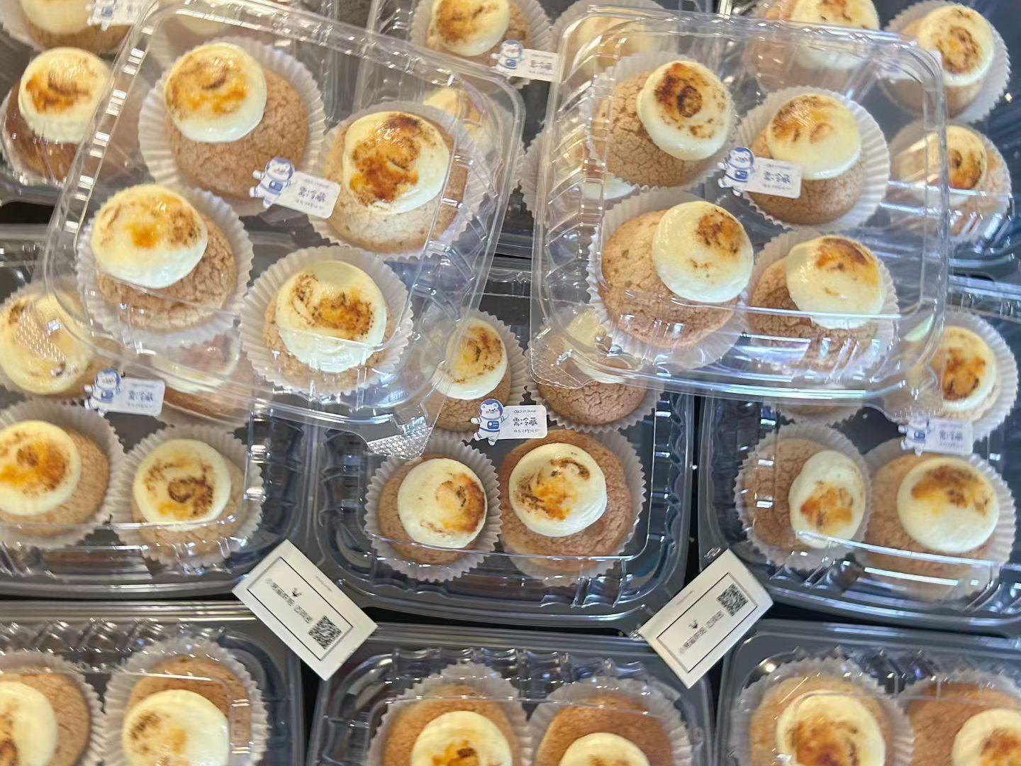 Muffins topped with brulee-style cream, served in plastic trays at D For Dessert, a Coffee & Cake Shop in Hollywood