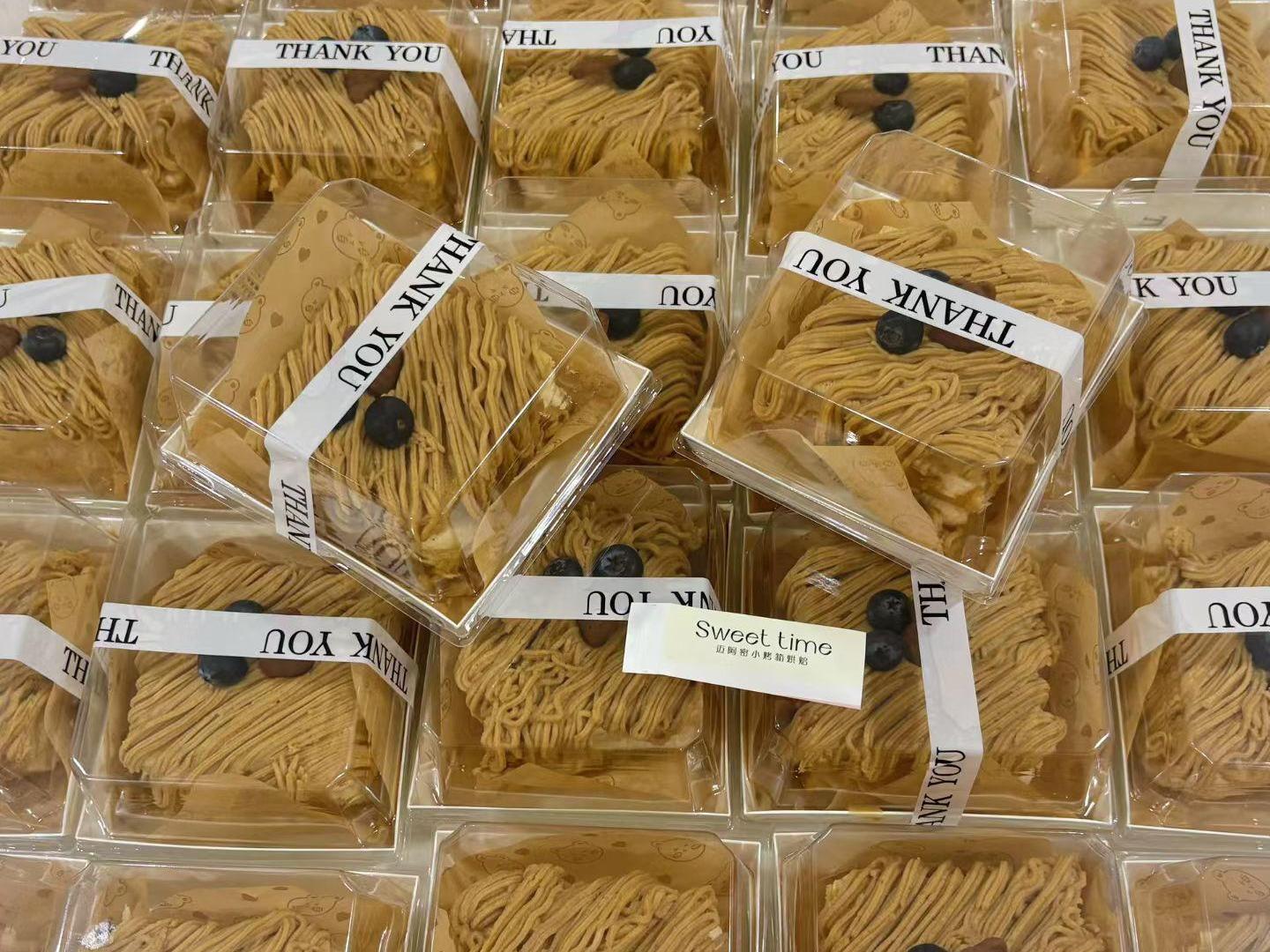 Crispy layered pastry topped with blueberry, wrapped with "Thank You" band at D For Dessert, a Coffee & Cake Shop in Hollywood