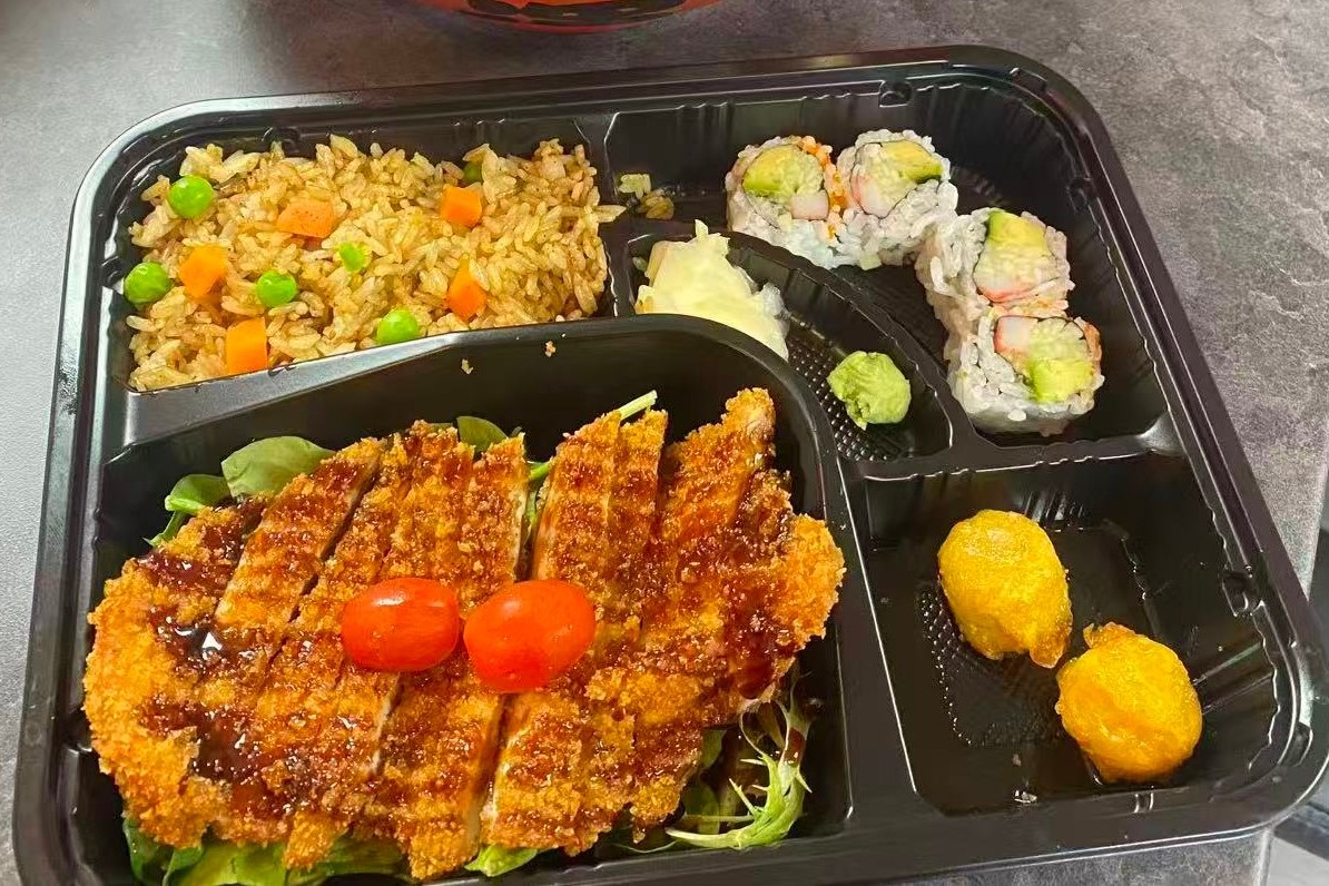 Dharma-Sushi&Grill-Japanese-Restaurant-Chicken-Katsu-Bento-Box-Schenectady Bento box with chicken katsu, fried rice, sushi rolls and side dishes at Dharma Sushi & Grill, a Japanese Restaurant in Schenectady